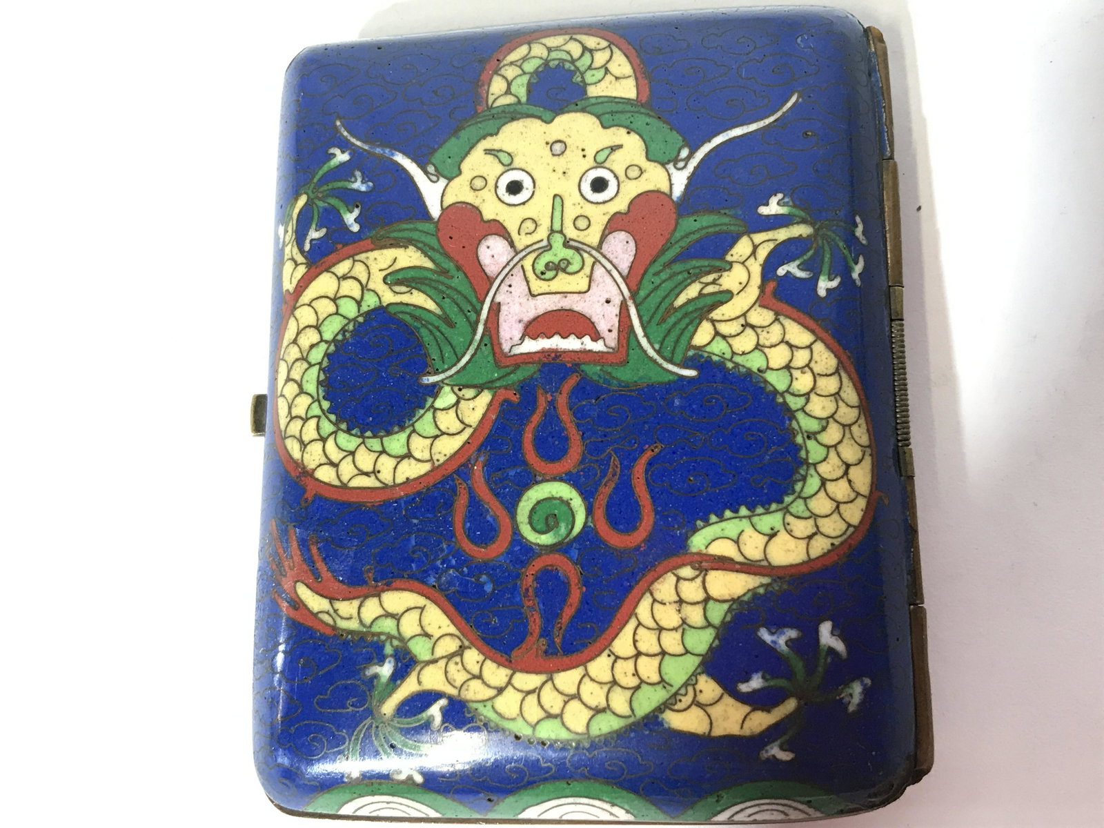 Vintage Cloisonne Cigarette Case: Vintage Cloisonne cigarette case. Front and back of the case depict dragons. Measures approx 3.25 inches H, and 2.5 inches W. Wear is consistent with age and use. Cigarette holder, cigarette case, Eas