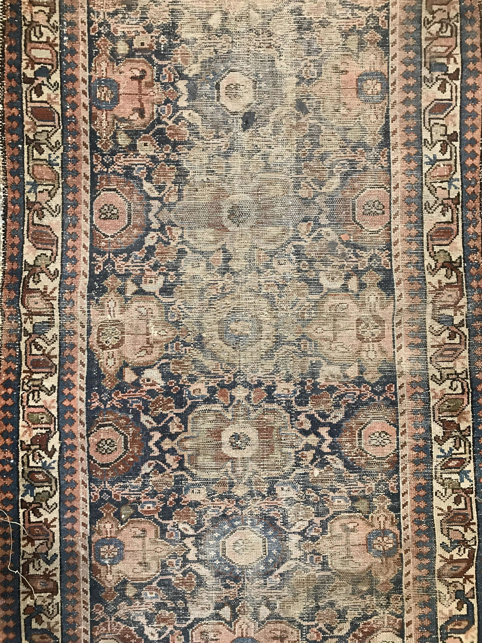Antique Handmade Wool Rug: Rug is wool and handmade. Piece is antique. Appears to possibly be Persian. Rug has intricate floral, leaf & geometric detail. Piece measures approximately 70 inches long 40 inches wide. Rug, carpet,