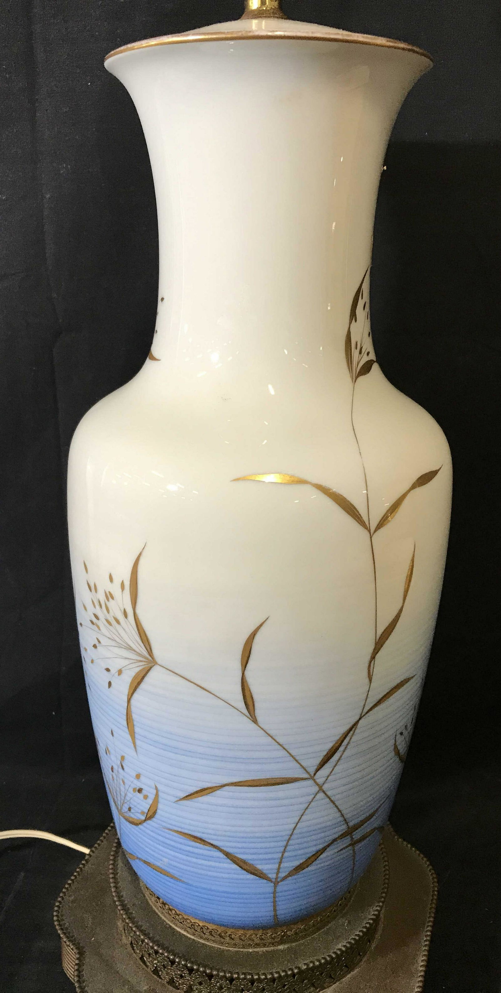 Hand Painted ROSENTHAL Tabletop Lamp: ROSENTHAL Lamp, possibly vintage, base is brass. A series of blue striations produce a gradient effect. Gold toned paintings decorate the body. The finial is a colored glass sphere. Measures approx 36