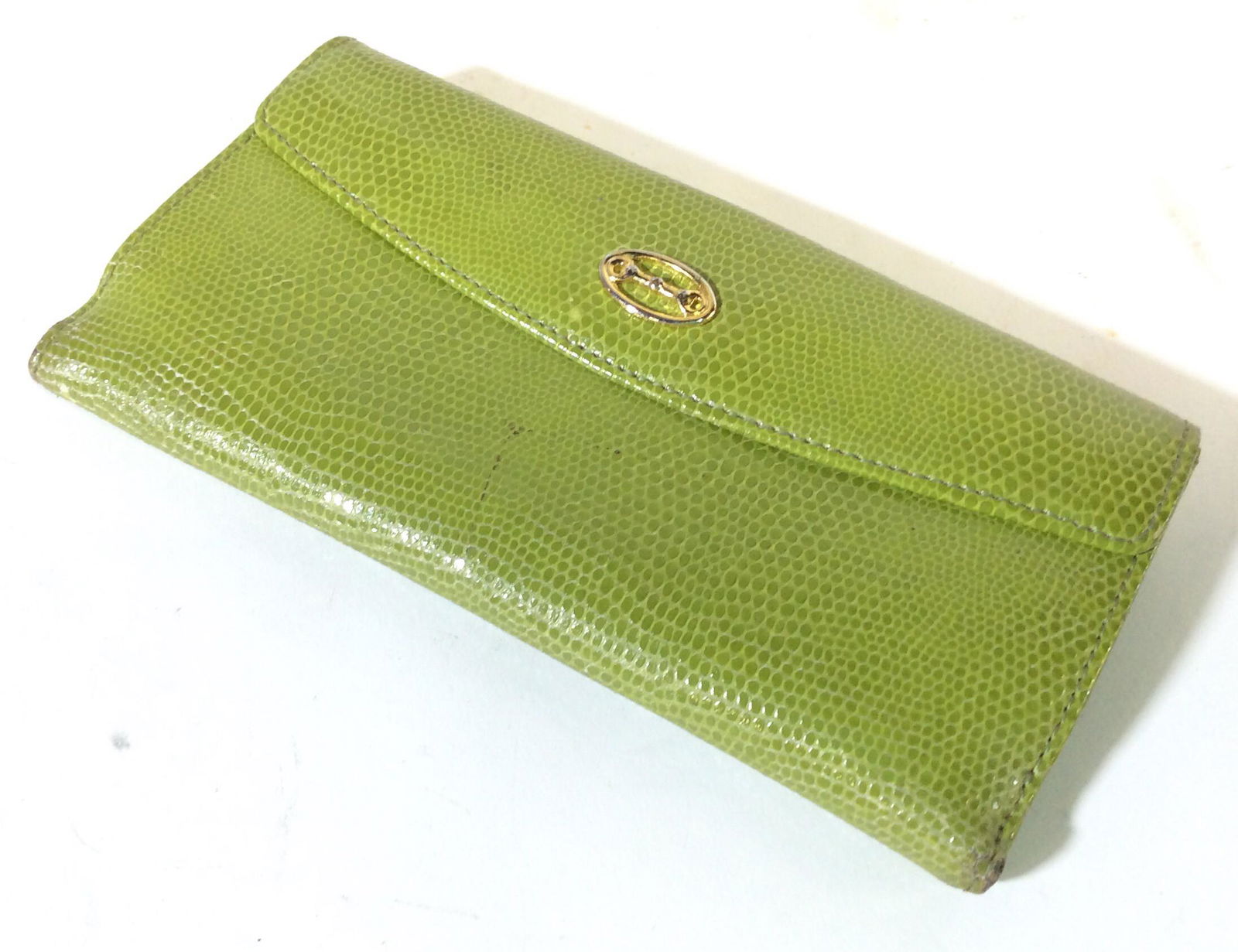 M. London Neon Leather Wallet, Italy: Signed M. London Genuine Leather On Interior, snap labeled Fiocchi Italy. Reptile leather, Smooth hand, holds CC, bills and change. Good pre owned condition. 6 3/4 in x 3.5 in. Thickness 7/8 in. M Lon