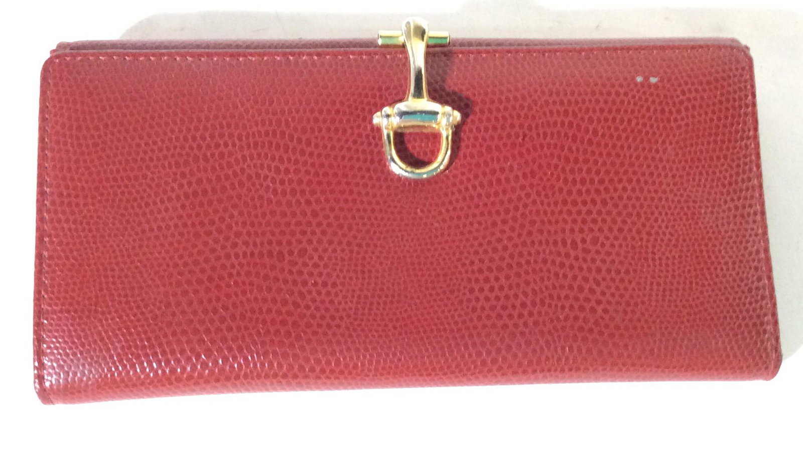 M. London Red Leather Wallet: Signed M. London Genuine Leather On Interior, snap labeled Fiocchi Italy. Reptile leather, Smooth hand, holds CC, bills and change. Good pre owned condition. 6 3/4 in x 3.5 in. Thickness 7/8 in. M Lon