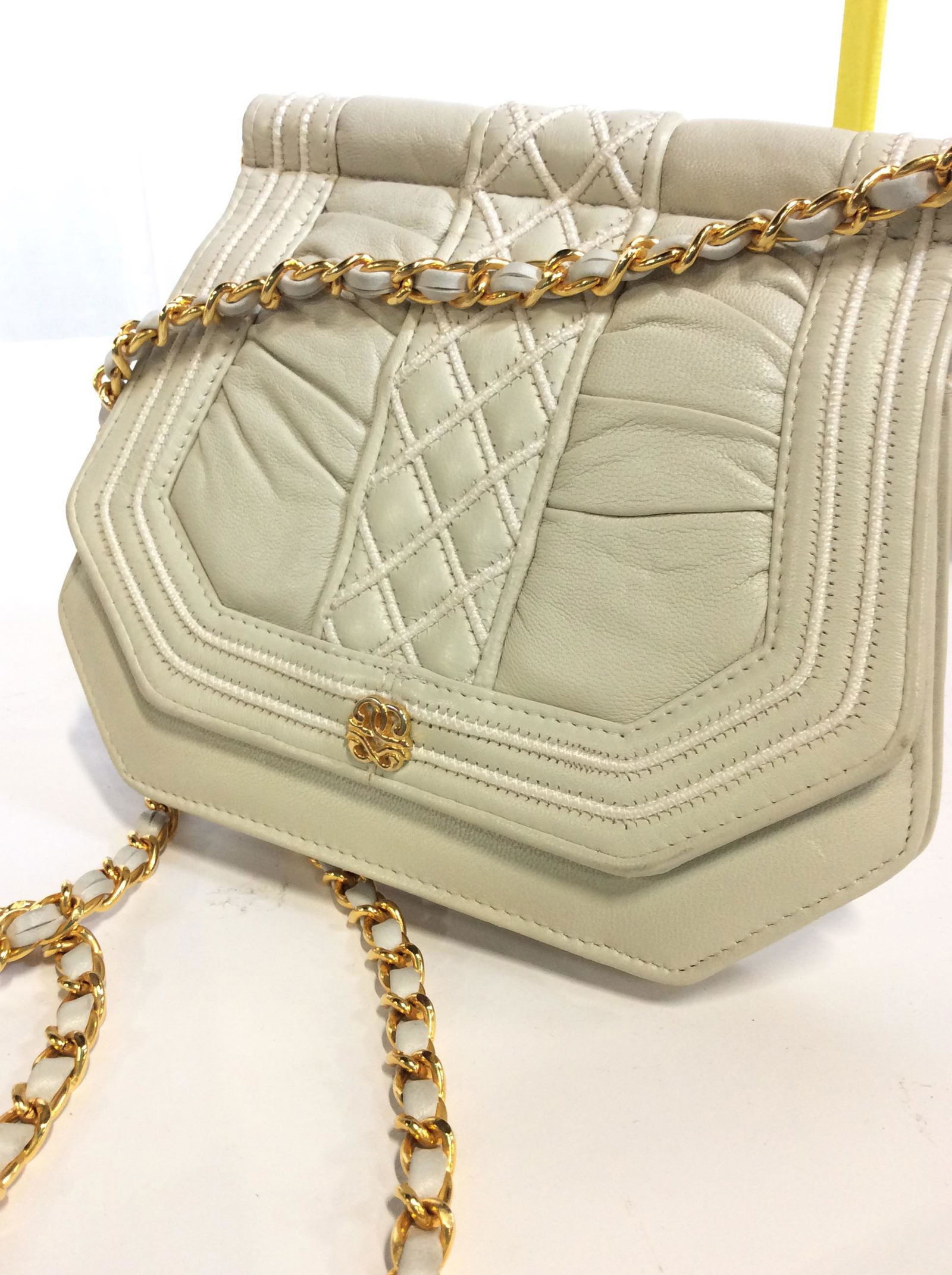 RAPPL Vntg Two Sided Leather Shoulder Purse, Eng.: Gold toned chain wrapped around strap which hangs 21 in. Metal increases weight of piece. Both sides of Purse have flap that opens with snap closure. Measures 8.5 in W x 7 in. H. Designer label sewn i