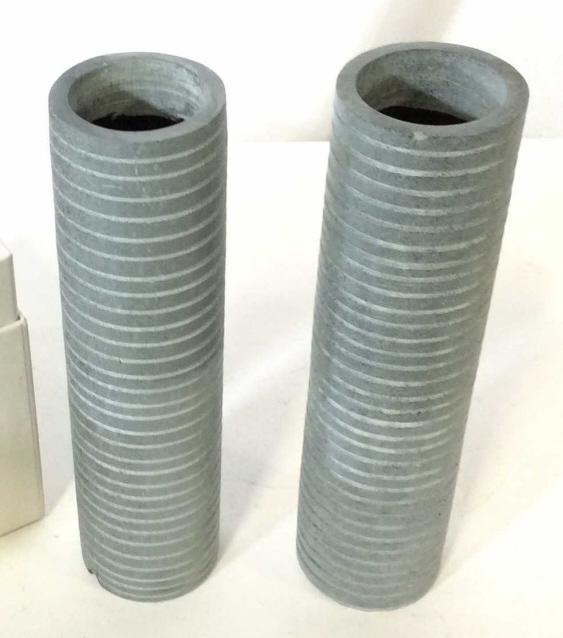 Pair ARMANI CASA Stone Vases W Box: Pair Armani Casa studio gray/blue stone bud vase measuring 8" high and 2" in diameter. Designer sticker label on underside. Comes in original Giorgio Armani Box, in good condition. Some chips, weighte