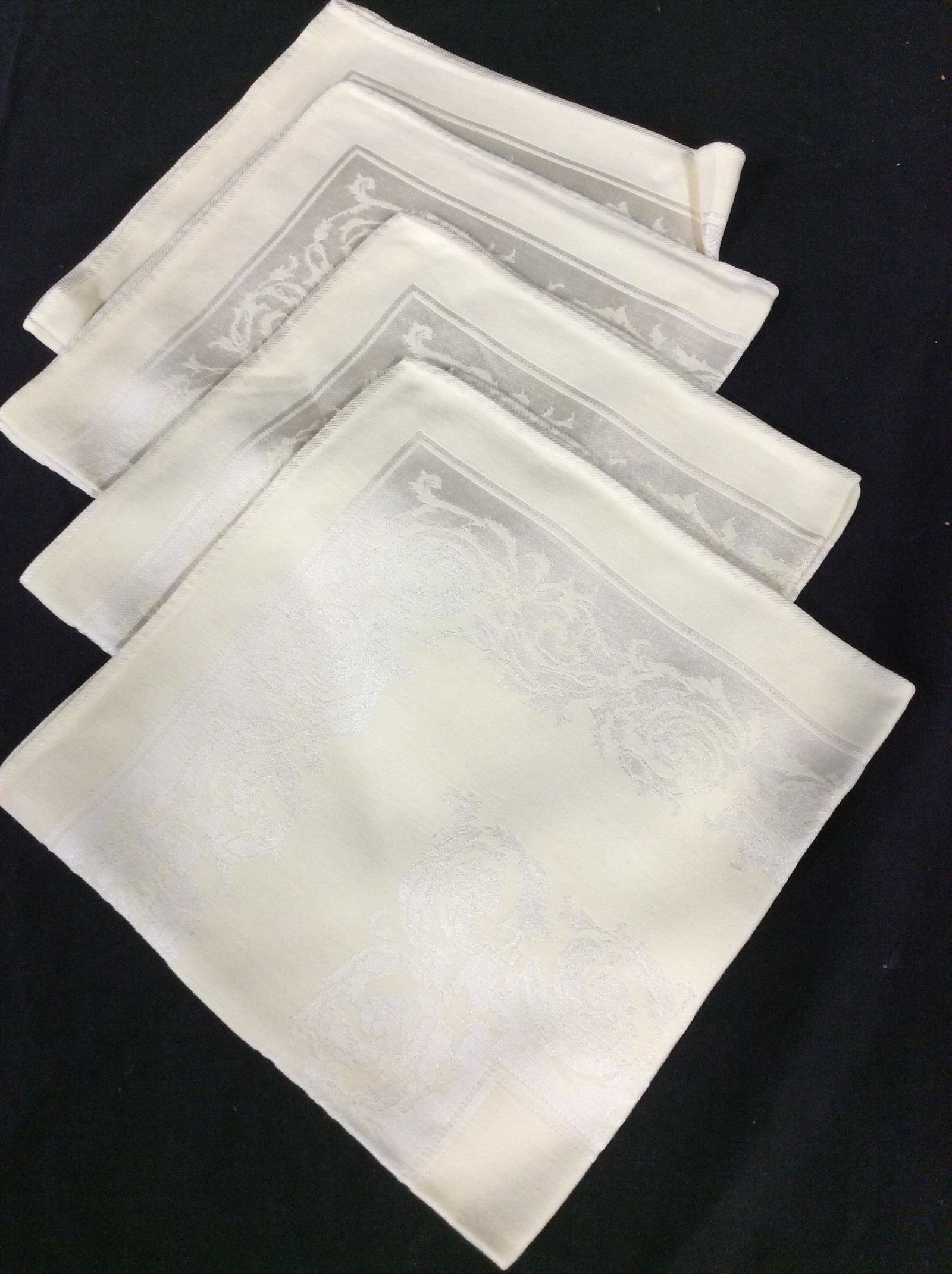 Tablecloth and Napkin Set , 8 pcs: Light yellow with florals & scrolls matching set 4 cloth napkins and 80 x 60 in table cloth. 3 extra linen napkins, white. Possibly all cotton / Nylon combo Mild blemishing to a few pieces. Napery, Cl