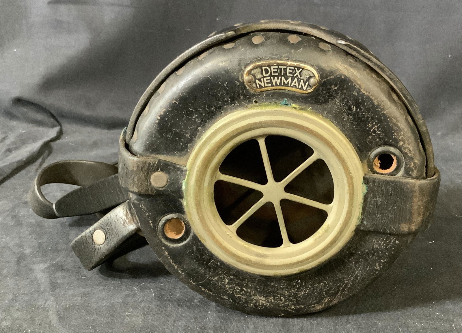 Vintage Detex Newman Watchclock Bag: Vintage Detex Newman Watchclock bag with handle, Bag intended to house a clock with clasps, window for viewing face of timepiece, evident wear on straps and leather, portions of metal have discolorati