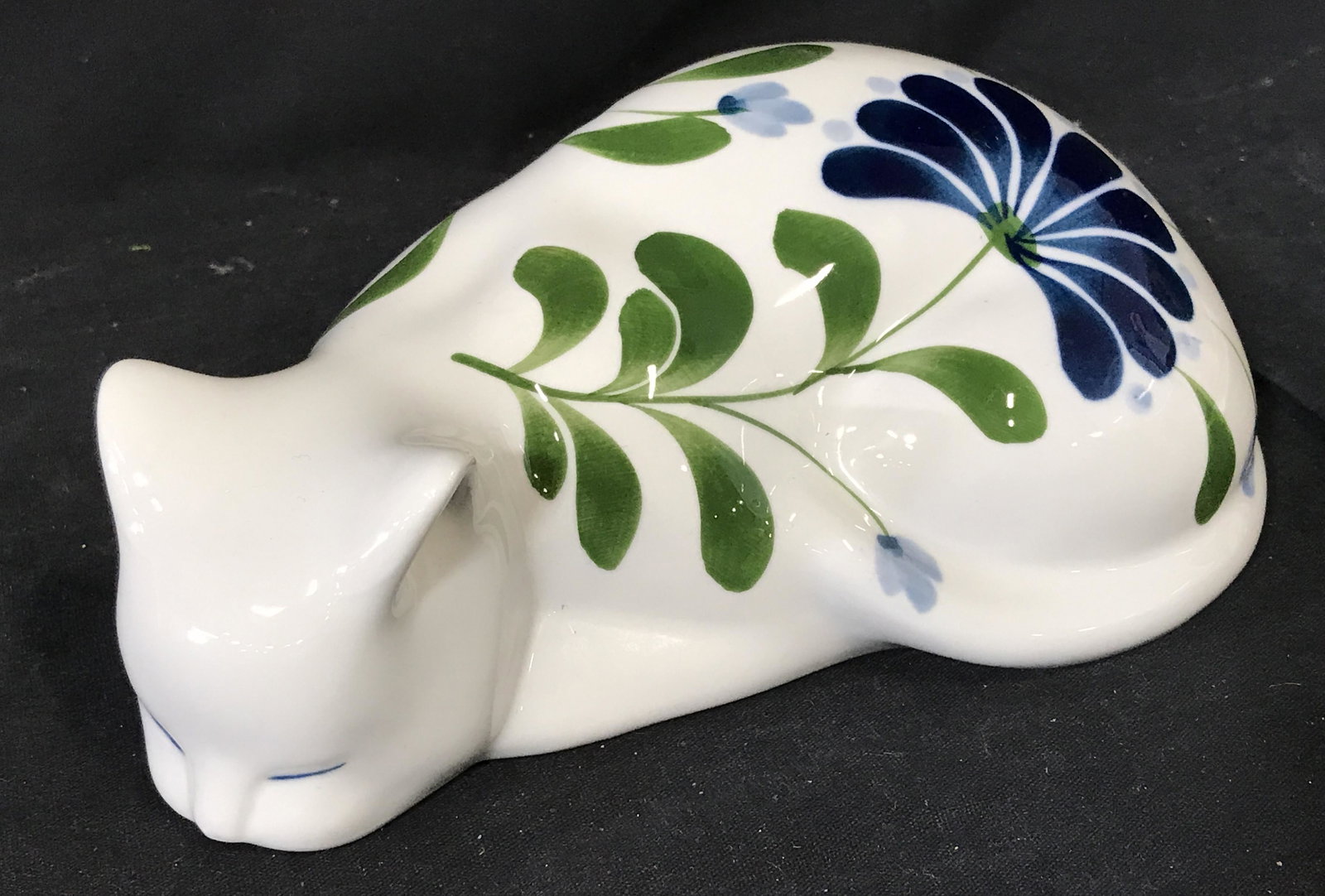 Dansk Porcelain Cat Figural: Dansk Porcelain cat, stamp to bottom reads ‘Dansk International Designs Ltd NR/Philippines’, hollow formed, subject a hen with blue and green floral designs to the surface, measures 8 inches wides