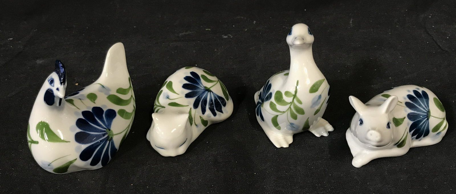 Group Dansk Porcelain Animal Figurines: Group of 4 Dansk Porcelain animal figurines, stamp to bottom of all reads ‘Dansk International Designs Ltd NR/Philippines’, hollow formed, subject a hen cat duck and pig with blue and green floral