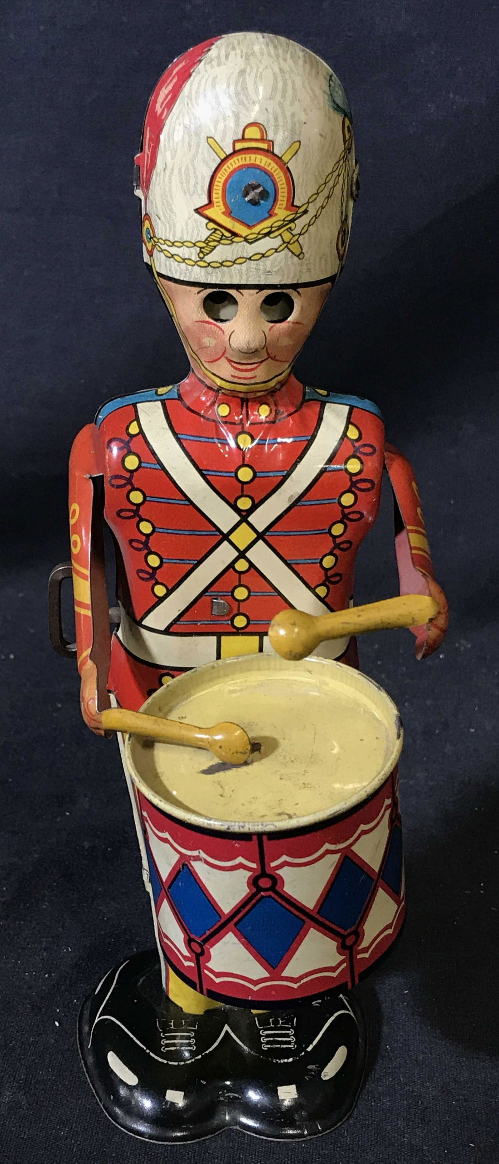 Vintage Metal Wind Up Drummer Toy: Vintage toy metal wind up drummer, subject a solider drummer with eyes that move as he plays, stamp to reverse reads ‘Made in the United States of America, New York NY’, measures 9 inches at talle