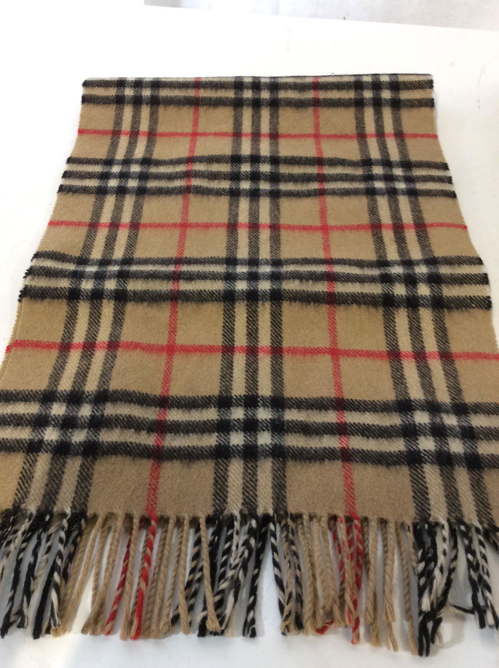 Unisex Plaid Fall/ Winter Scarf: Burberry Style Pattern, Tan with red, black and white stripes. End Tassels, soft Hand. Possibly cashmere or pashmina. 12.25 x 54 in. Outerwear Accessory, Men’s Scarf, Ladies Scarf, Neck Scarf, Plaid