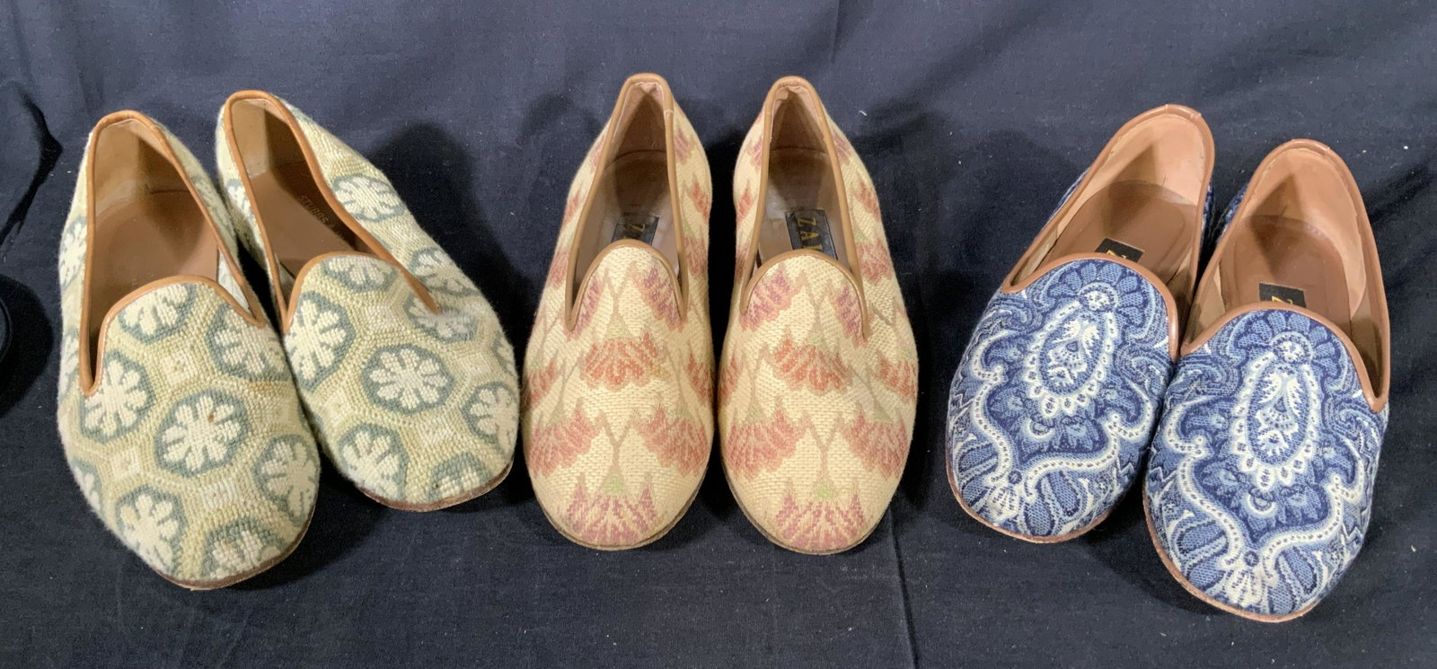 Set of Three Pairs of Decorative Loafers: Labels on two pairs read Zalo Made in Spain, one pair is labelled Stubbs & Wooton Palm Beach Spain. Three pairs of loafers with decorative stitching patterns on each, two pairs are size 9 and one is a