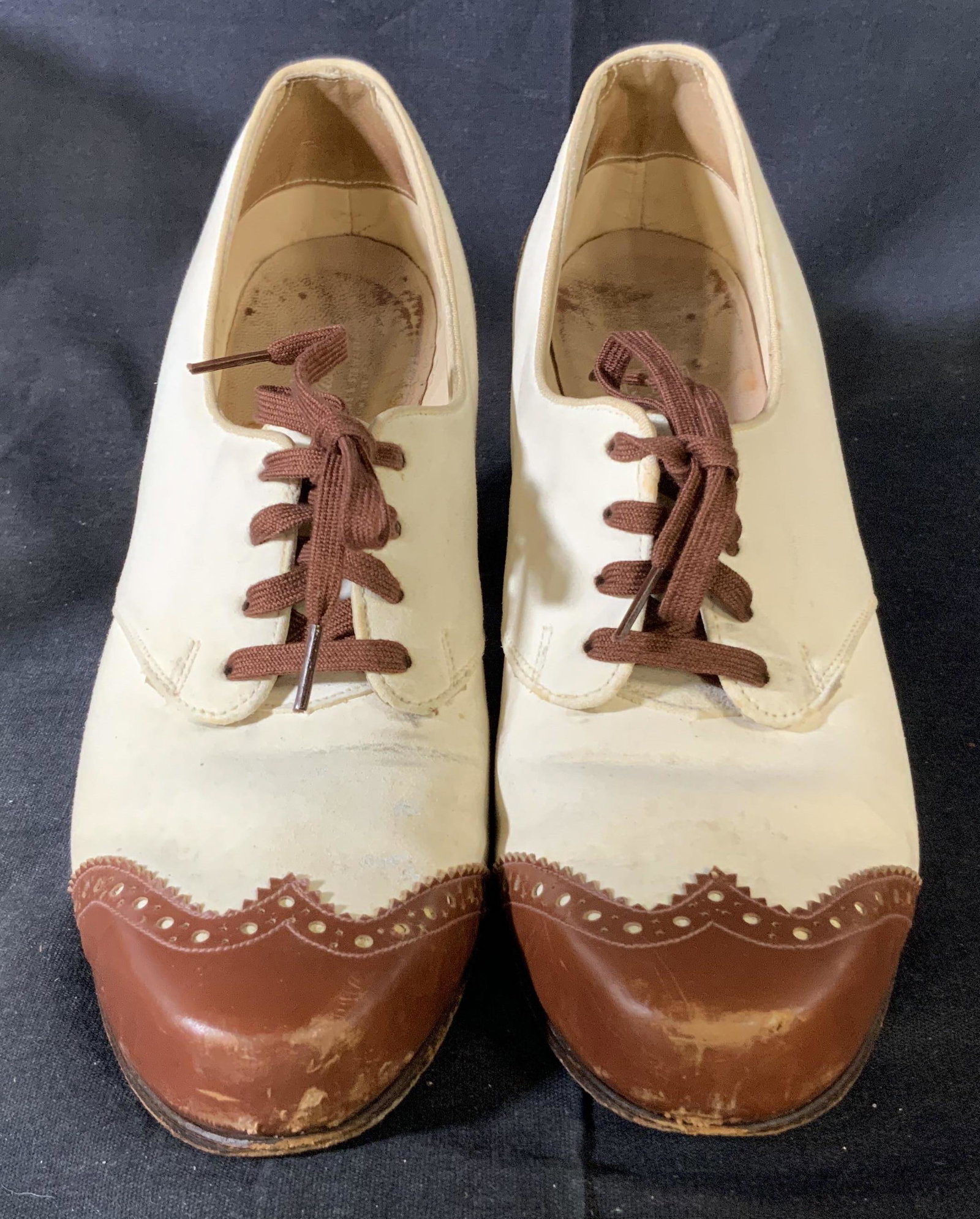 Vintage High Heel Oxfords Shoes: vintage oxford high heels in white with brown detailing and laces, size 38 in European sizes, some aging and scuffing, heel is 2.75 inches tall at they’re highest point with a white suede body, Vint