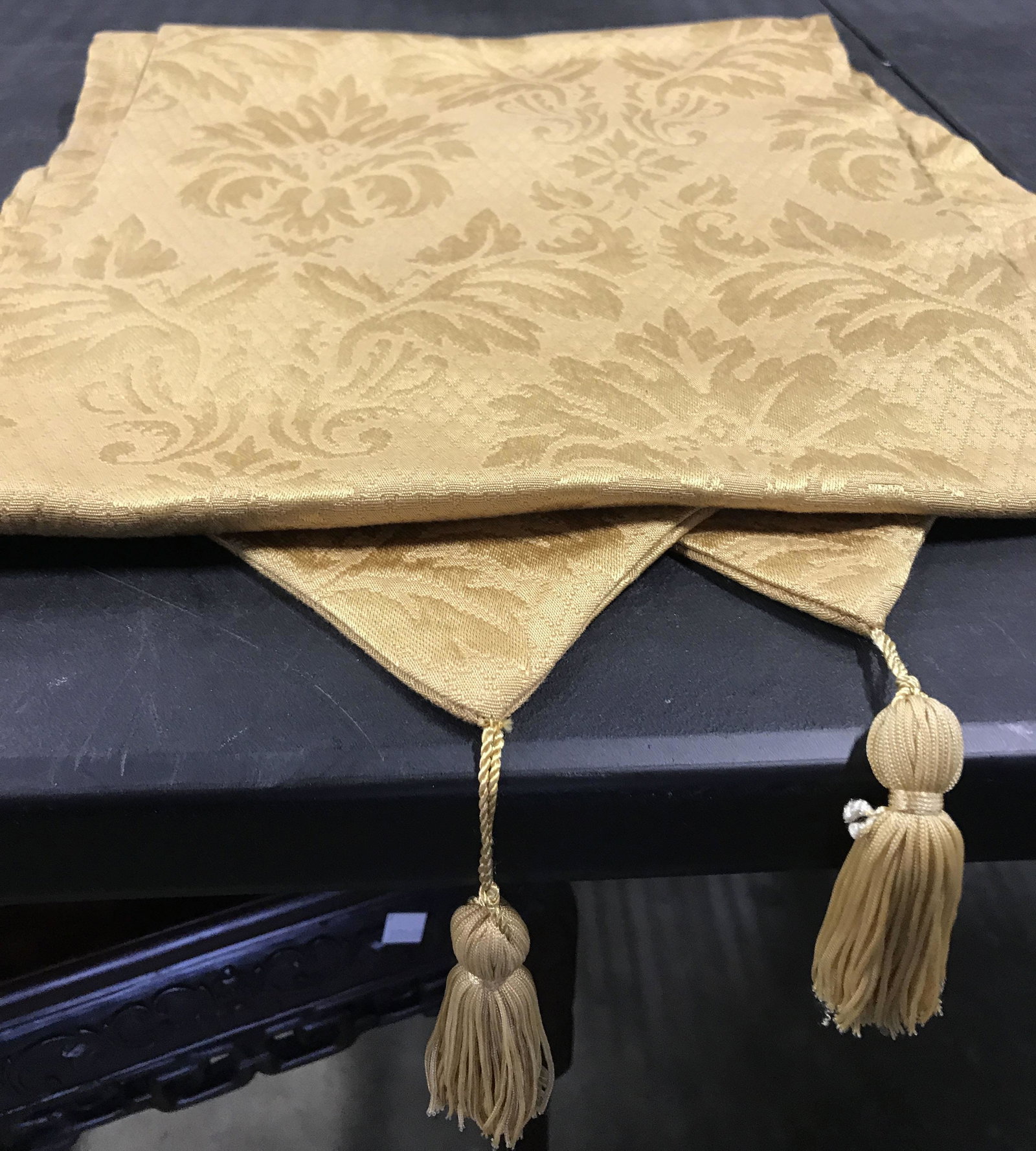 Retro mid century padded table runner: Tassel at long ends. Mustard yellow, typical of mid century colors, French floral design, 13 3/8 in. Wide, 68 in. Long. Couple spots. Table runner, mustard yellow, table decor, mid century table runne