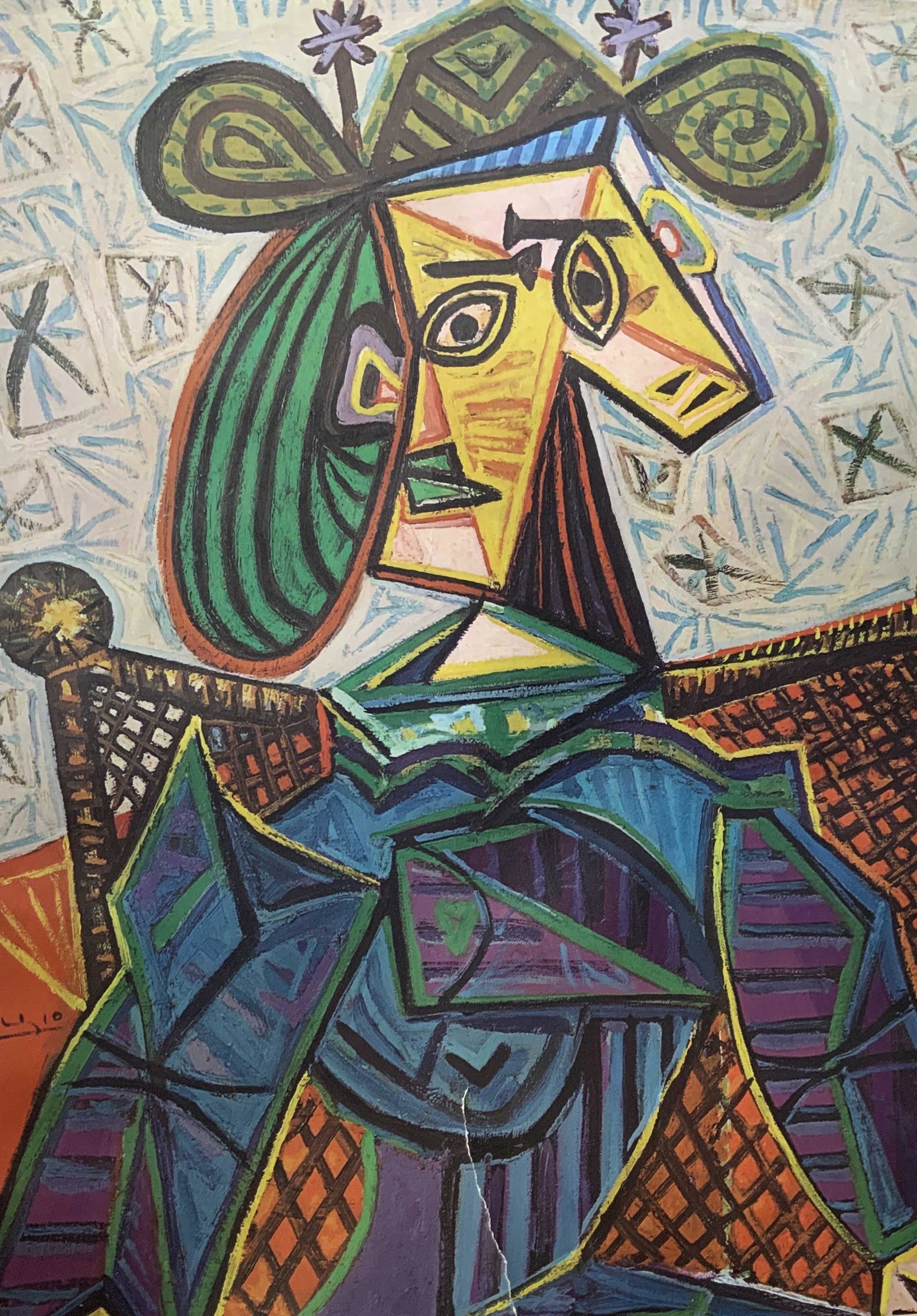 Picasso Woman Seated in an Armchair Ad Poster: Picasso Woman Seated in an Armchair advertisement poster, inscription to lower portion of piece in German, a woman sitting in an armchair painted in Cubist style, measures 33 1/4 inches x 24 1/4 inche