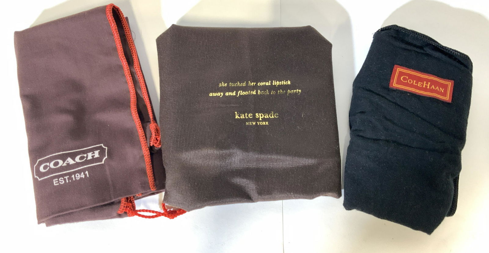 Lot 3 Designer Purse Bags & Cloth: Lot includes COACH dust cover, KATE SPADE dust cover, and a COLE HAAN shammy cloth. Largest piece measures approx 15 inches H, 19 inches W. Wear is consistent with age and use. Dust cover, dust bag, s