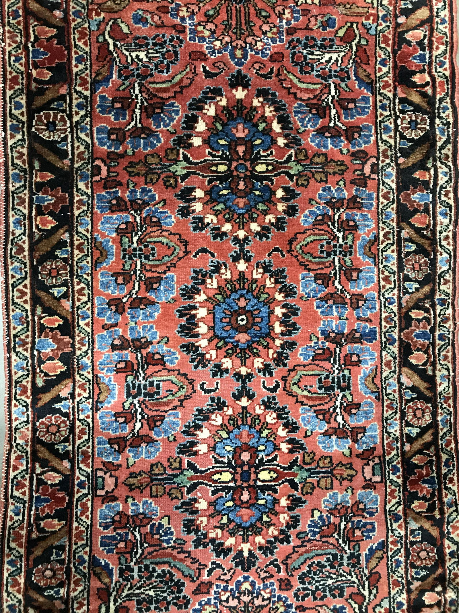 Antique Handmade Persian Wool Rug: Rug is wool and handmade. Piece is antique. Rug has intricate floral, vine, leaf and geometric detail. Persian rug, rug, wool rug, vintage rug, antique rug, handmade rug, area rug, carpet. Piece measu