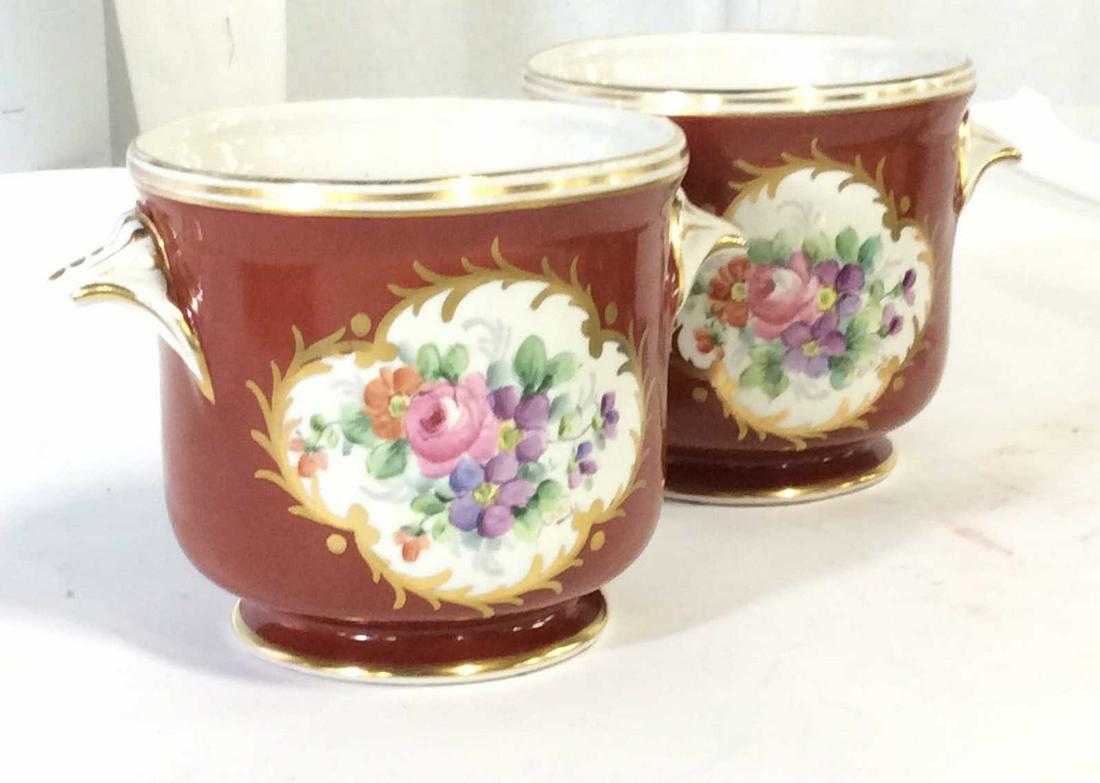 Pair SIGNED Hand Painted LIMOGES Cachepots: Possible Antique. Verso has handwritten potters Mark, Reads ‘Limoges Hand Painted’ in orange ink under glaze. Artist signed by hand lower right near florals, reads ‘OLC’ Deep Orange Rust Color