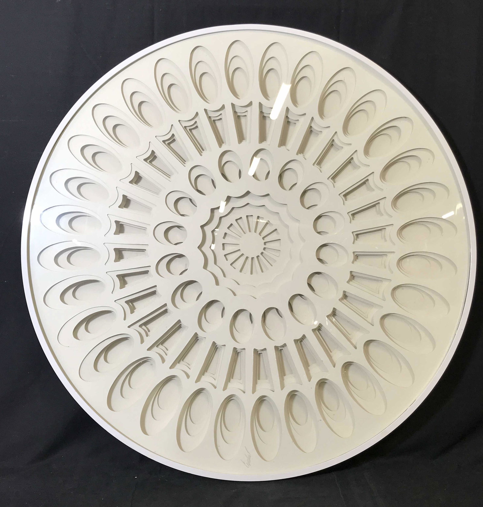 Greg Copeland Signed Layered Cut Out Artwork: Greg Copeland Signed Layered Cut out, signature along the lower border reads ‘Copeland’, subject an abstract layered cut out with a Ferris wheel design, white painted circular wooden frame, measur