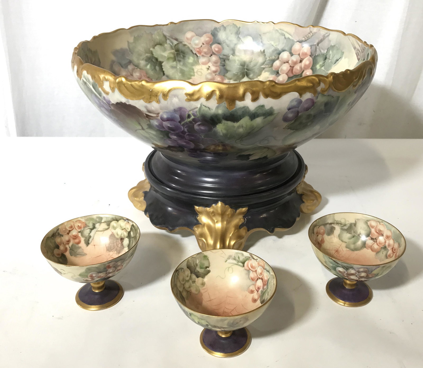 Antique LIMOGES Pedestal Bowl & Cups: Antique LIMOGES set, includes bowl with base, and 3 cups. Underside of cups reads as: EH GEORGE, one of the cups are dated 1916. Underside of bowl reads as: EH GEORGE, 1912., stamped T&V LIMOGES FRANC