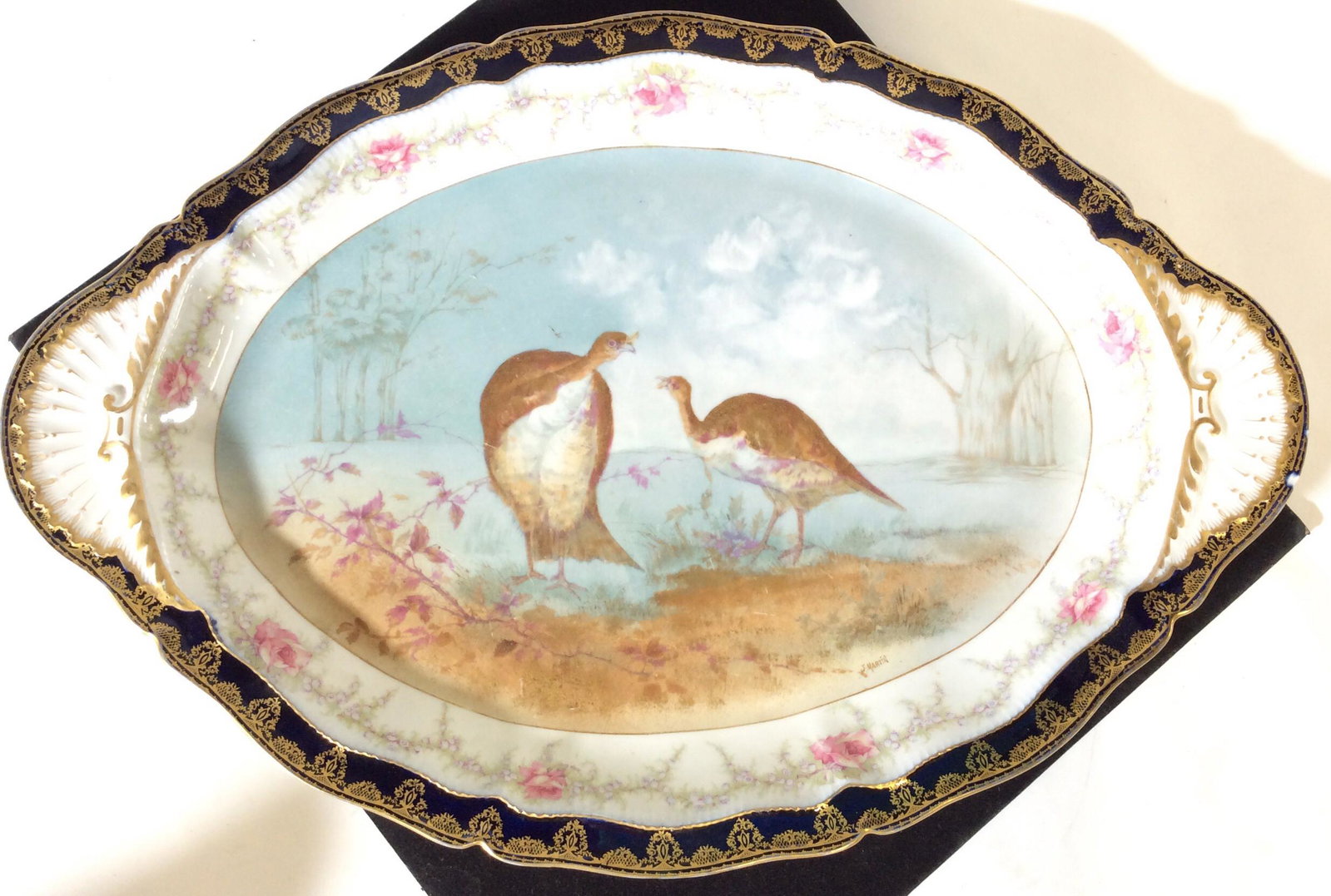 Signed T&H Limoges France Gilt Pheasant Platter: C. 1893. Signed Platter, verso reads Théodore Haviland Limoges France in red ink under glaze. Impressed TH16 in Pottery. Decor depicts hand painted pheasants in the wild. Rose and laurel border with 