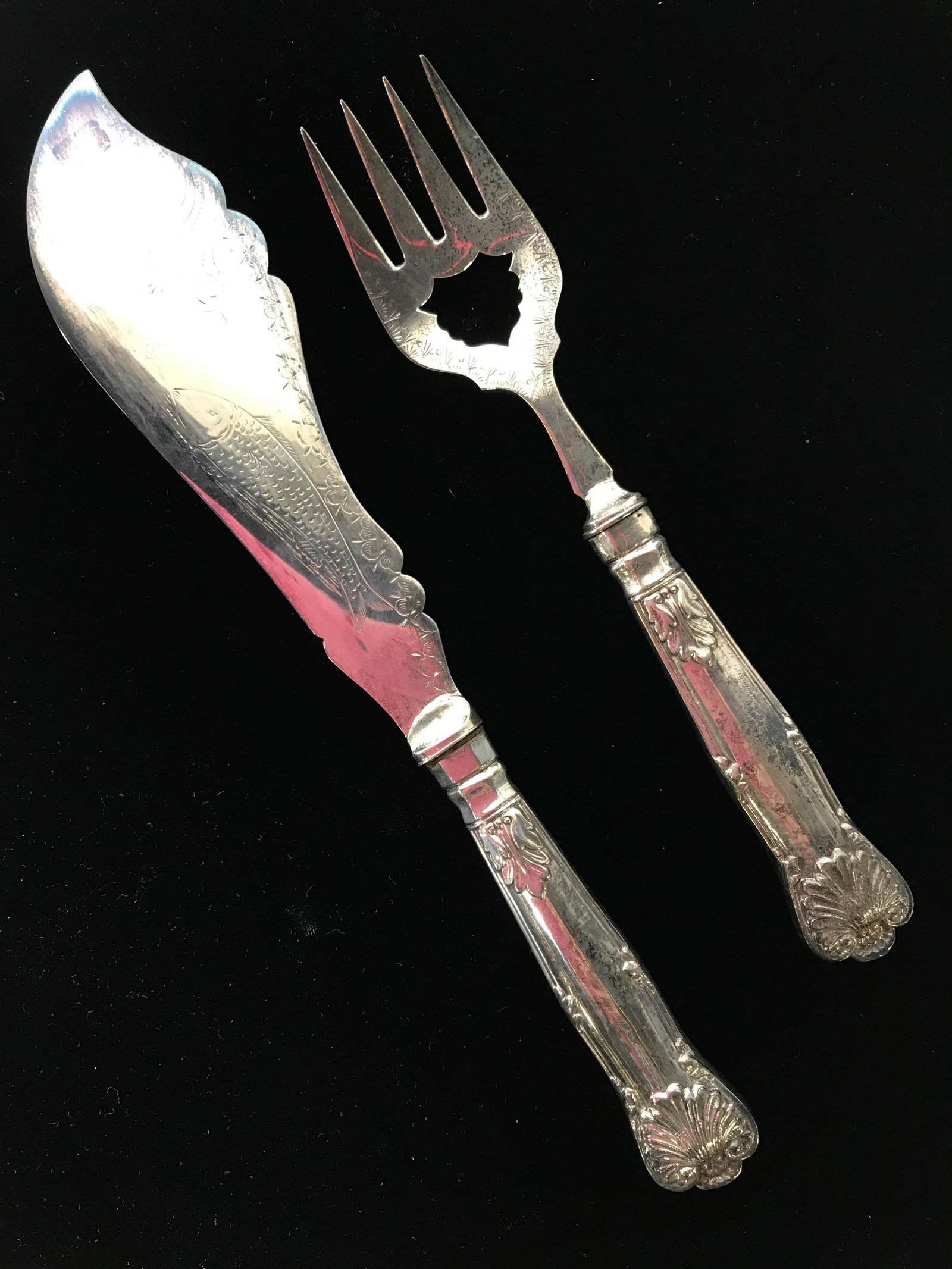Vintage Silver-plate Fish Knife & Serving Fork: Vintage, possibly antique fish knife, and serving fork. Hallmarks read as: AB & CO, S, EP. includes case, case is heavily worn. Wear on utensils is consistent with age. Utensils are decorated through 