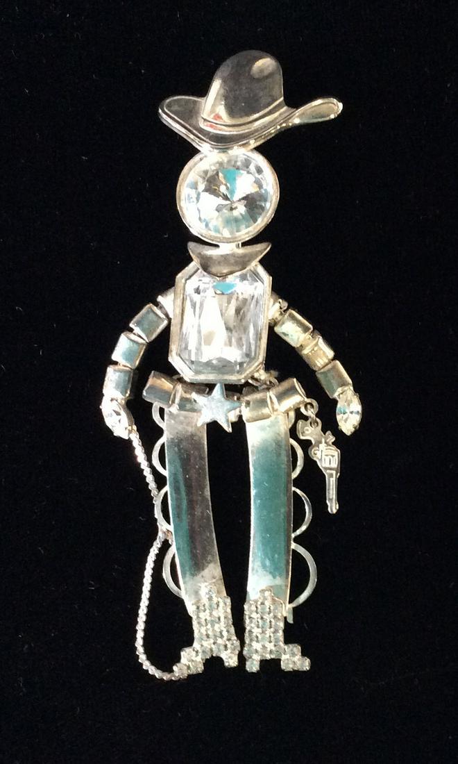 Silver Tone / Rhinestone Puppet Cowboy Brooch Pin: Oversize brooch, pin, Cowboy, rancher, Sheriff, accessory, Western jewelry, 4 in length, 2 in width. Rhinestone boots and solitaire rhinestone head, Marquis rhinestone hands, belt buckle with star, da
