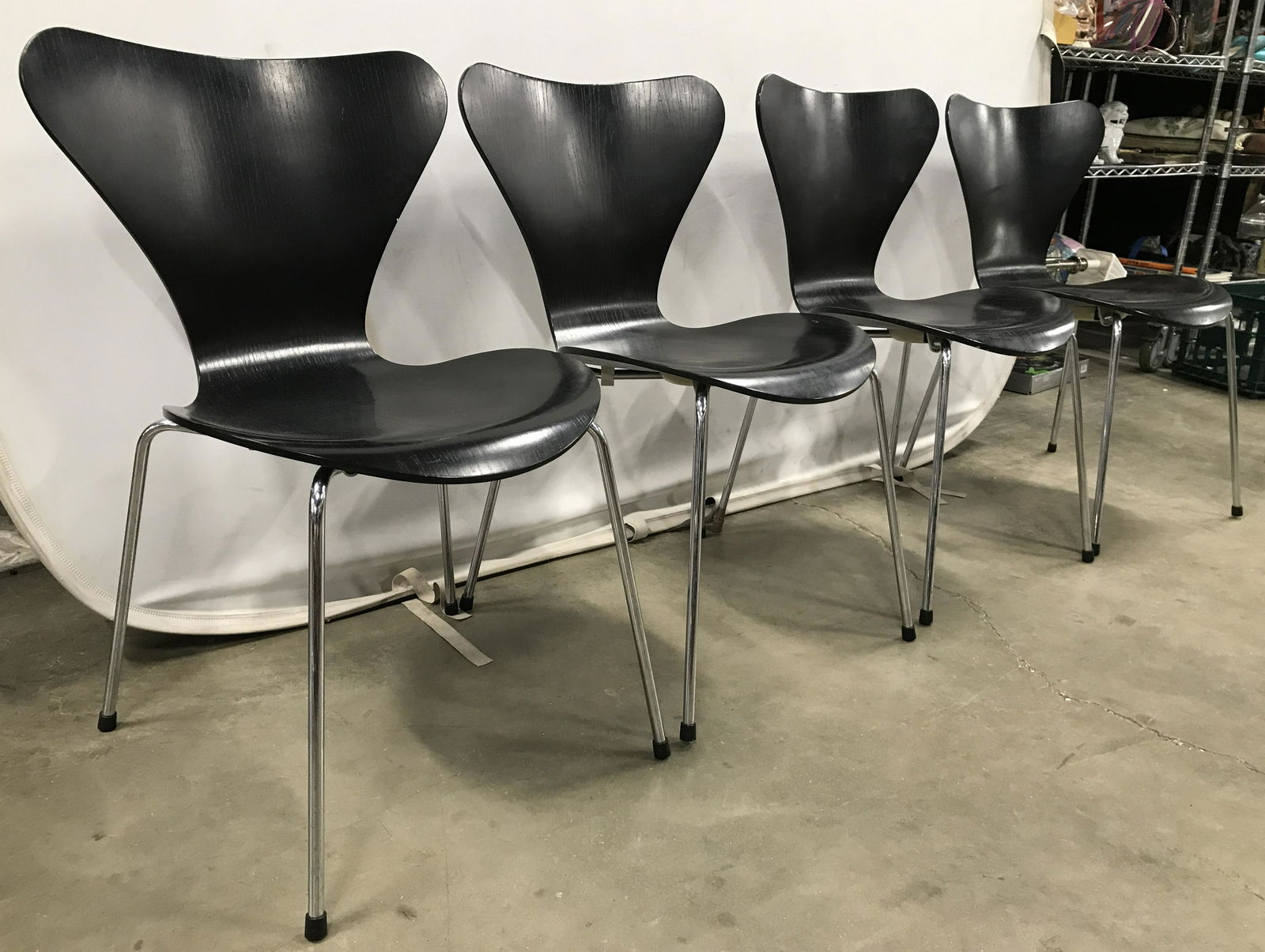 Set 4 FRITZ HANSEN ARNE JACOBSEN Danish Mdn Chairs: Lot includes 4 Chairs. Underside of chairs have tags which reads FRITZ HANSEN ARNE JACOBSEN. Each chair is black toned with chrome legs. Chair tags read Made in Denmark 1998. Each measures approximate