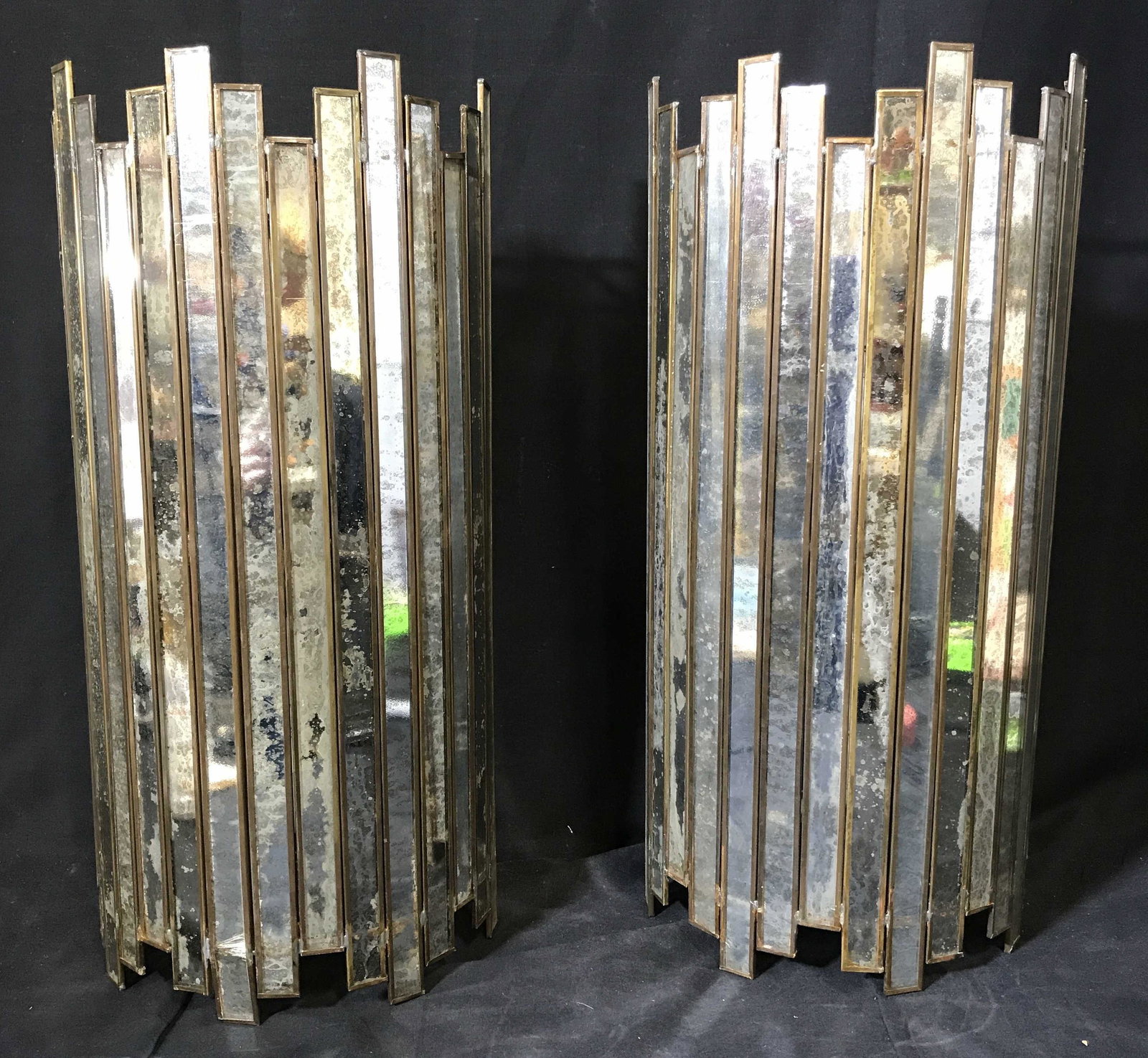 Pair Art Deco Wall Light Sconces: Pair Art Deco wall light sconces, both are made up of panels of mirrored glass with gold toned metal around each, each panel welded together at the top and bottom, some rust to metal, some breaks to g