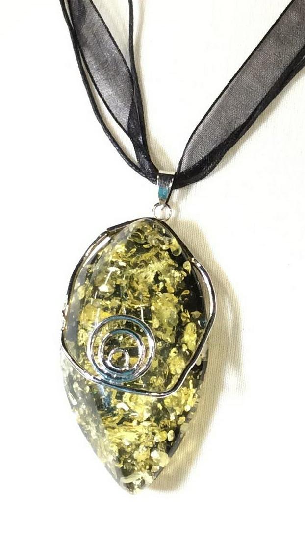 Artisanal Fashion Pendant 18KGP Necklace: Large resin pendant shaped like a rock, gold flecks on black underside. Decorative silver tone wire accents pendant. Adjustable Black Ribbon, 18 in. longest length. Bail is marked 18 K GP. Resin Rock 