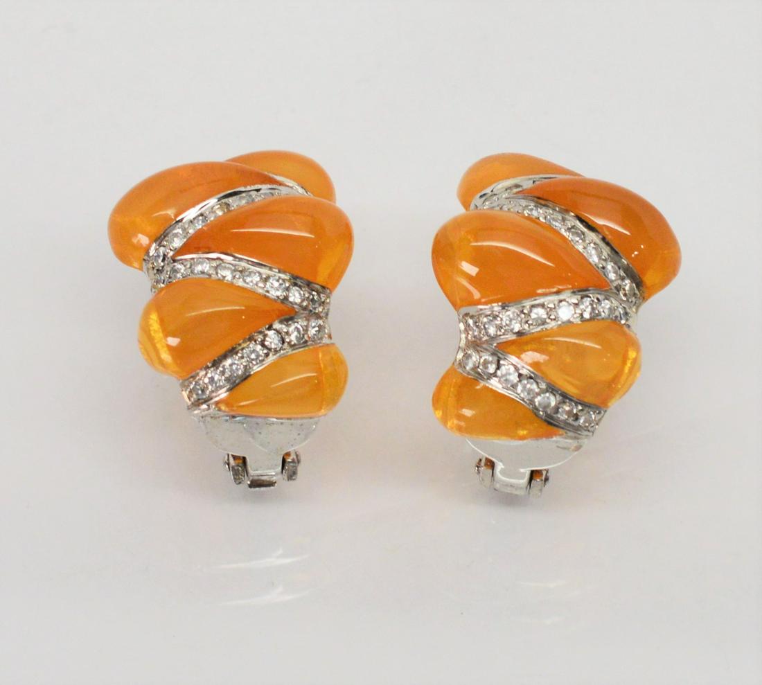 Angelique de Paris Sterling Earrings: Angelique de Paris Sterling Silver Cubic Zirconia and Resin Earrings Circa 1980, this bold pair of earrings will brighten any outfit. A larger huggie style earring by Angelique de Paris in signature p