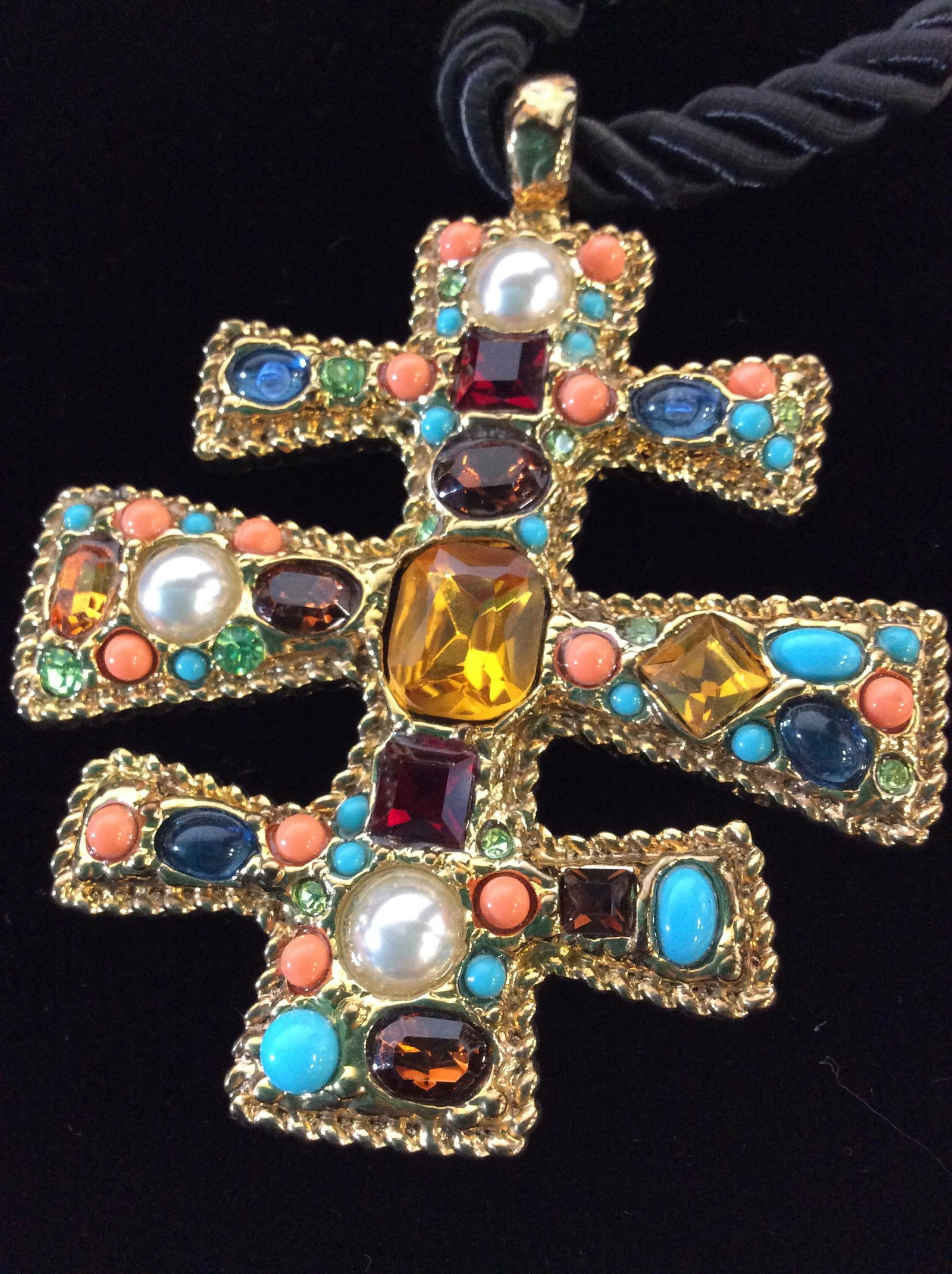 Signed KJL Multi Gem Rope Necklace, Org. Store Tag: Signed charm and verso disc read Kenneth Lane. Hook and loop closet attached to quarter in black Twisted Rope. Large Gold Tone Pendant w/ costume Topaz, peridot, citrine, coral, garnet and turquoise ,