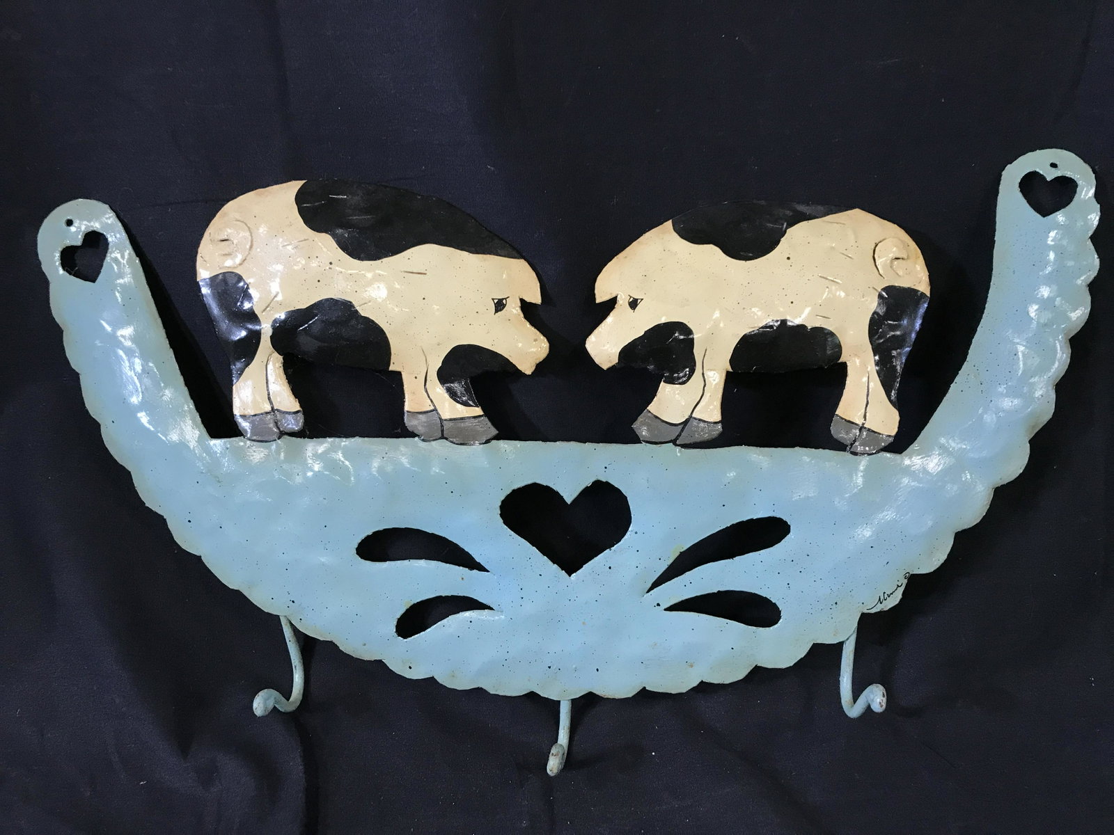 Vintage Signed Folk Art Wall Decor: Vintage metal Folk art, wall decor. Hand painted, depicts spotted pigs. Hearts shaped cutouts, the artists signature is in lower right sections of piece. Wear is consistent with age. Measures approx 1