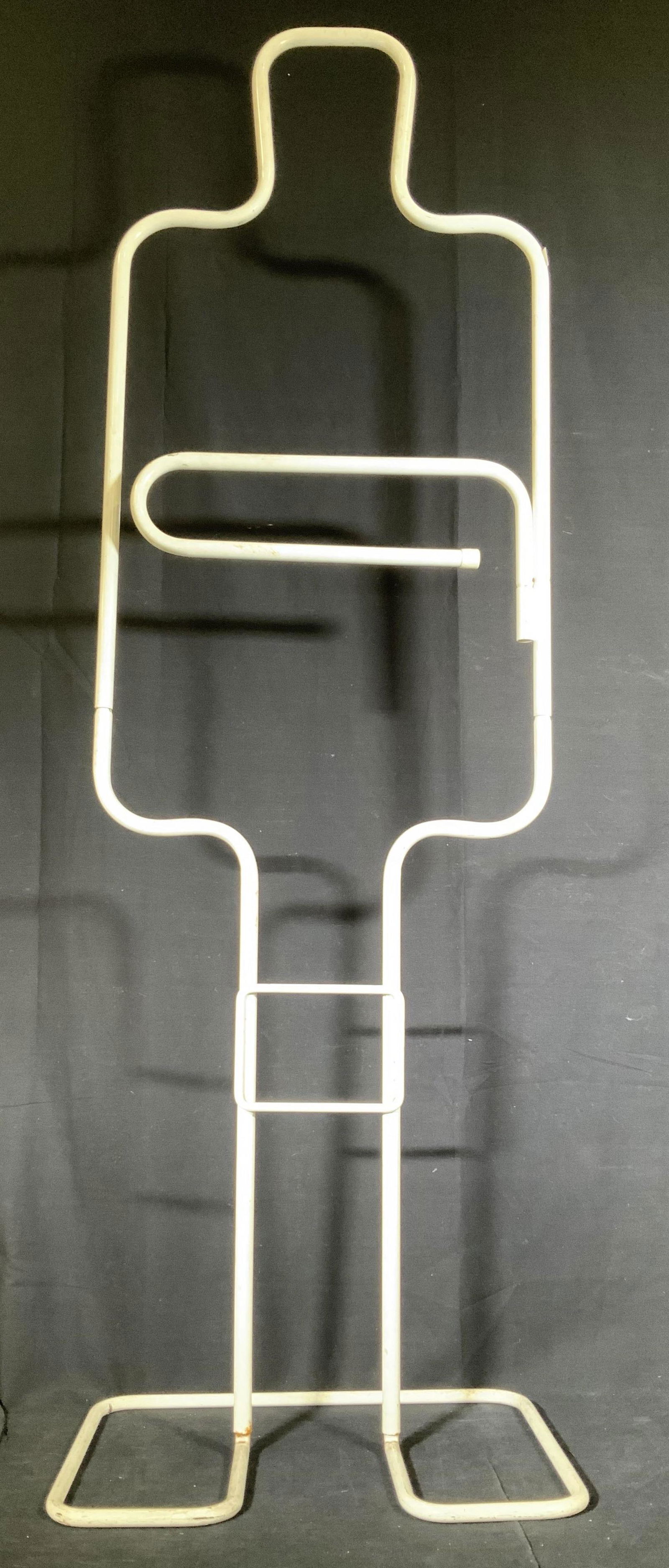 C 1970s Tubular Sculpture 4.5 ft Valet Stand: Circa 1970’s white tubular metal outline silhouette of male figural, valet stand with shaped head shoulders, torso, legs and outlined feet, Center tubular bars swing out possibly for pants, unusual