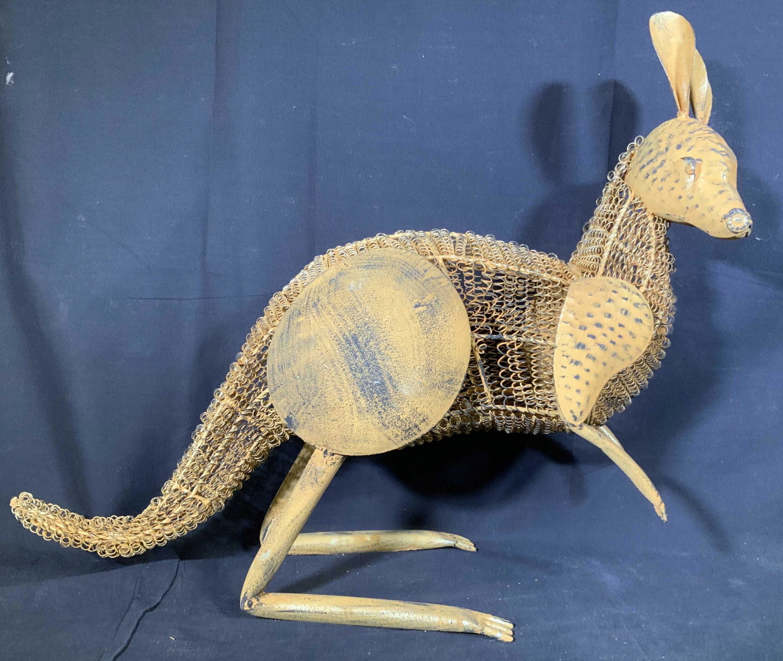 Folk Art Hand Forged Metal Kangaroo: Metal, metal tubes, mesh and wire, painted yellow gray black accents, hand crafted Kangaroo Sculpture floor size, sits on rear legs, with swooping tail and slightly curled ears, property of Nyack New