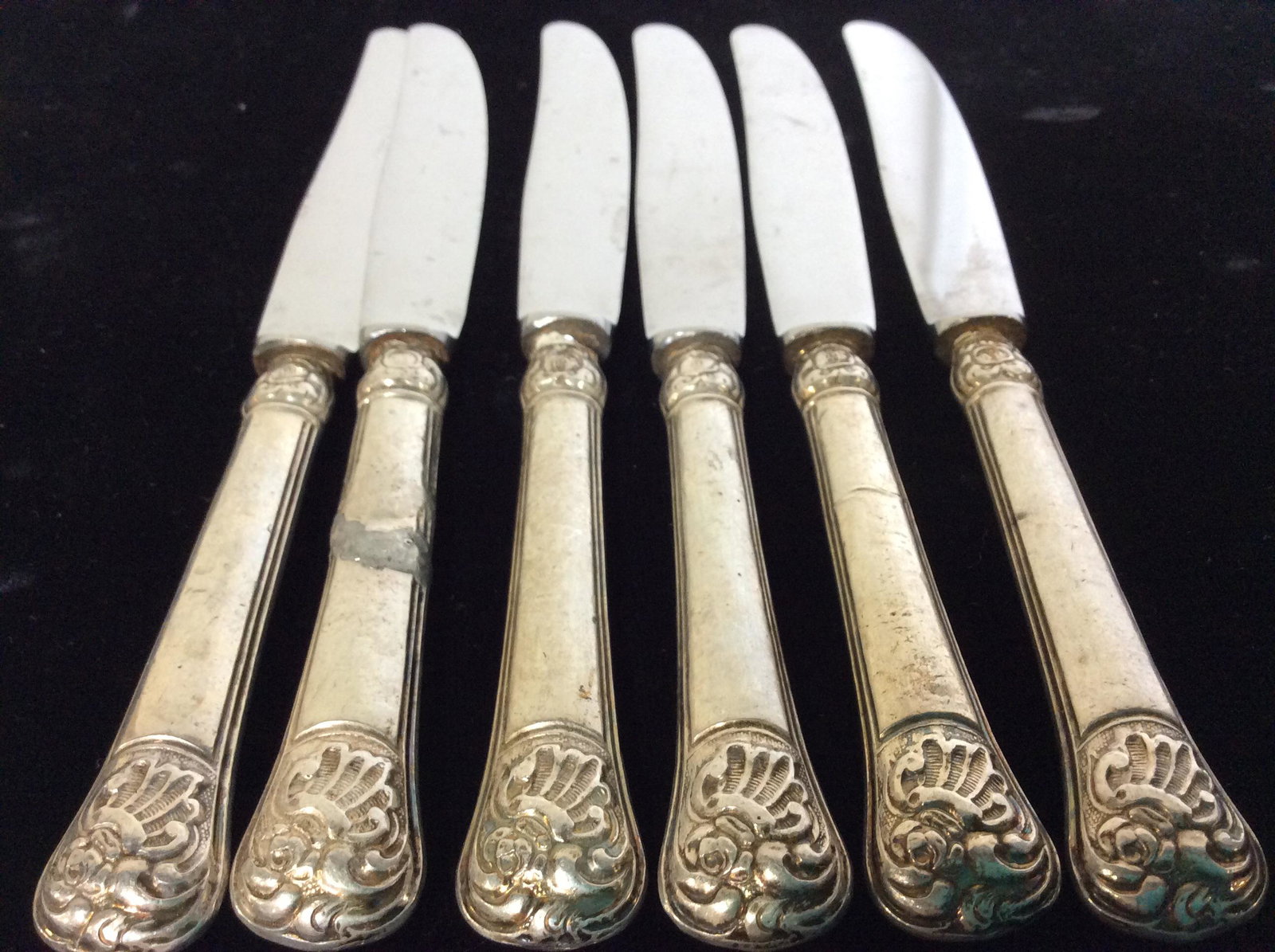 ROSTFREI Vntg Cocktail Fork Knife Set 12, Germany: 6 knives/ spreaders 7 in. long. Blade stamped WIDMANN ROSTFREI. Handle marked AB other side Hallmarked with type of crest with center ‘ rounded triton # 13 in center and ‘5’ to left, ‘B’ abo