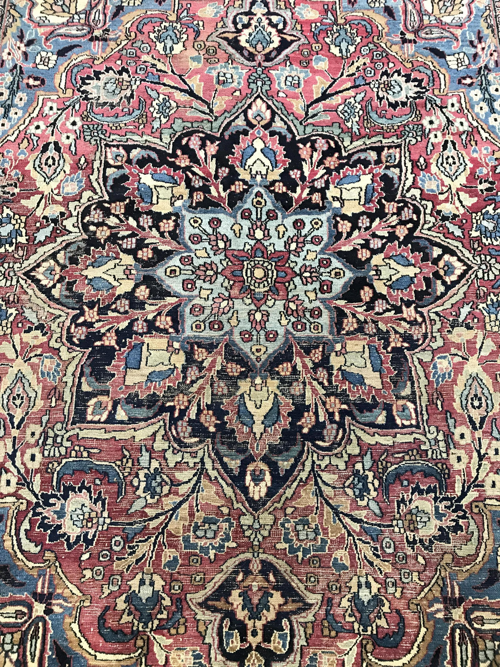 Antique Persian Handmade Wool Rug: Rug is wool and handmade. Piece appears to be antique. Rug contains multi toned floral vine & leaf detail. Piece measures approximately 132 inches long103 inches wide. Rug, carpet, area rug, wool rug,