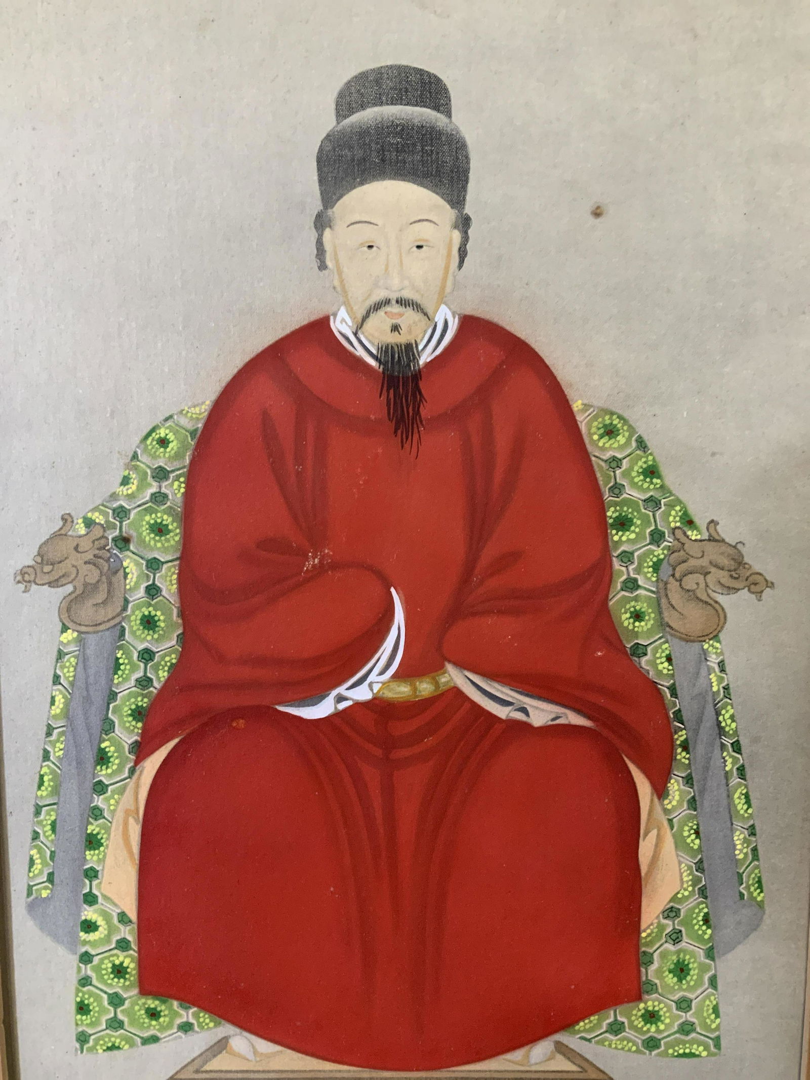 Chinese Portrait Painting of Male Ancestor: Chinese portrait painting in ink and color on fabric, middle aged man in elaborate traditional Chinese clothing and headdress seated on a chair, measures 35 inches x 28 7/8 inches, Hand carved wooden