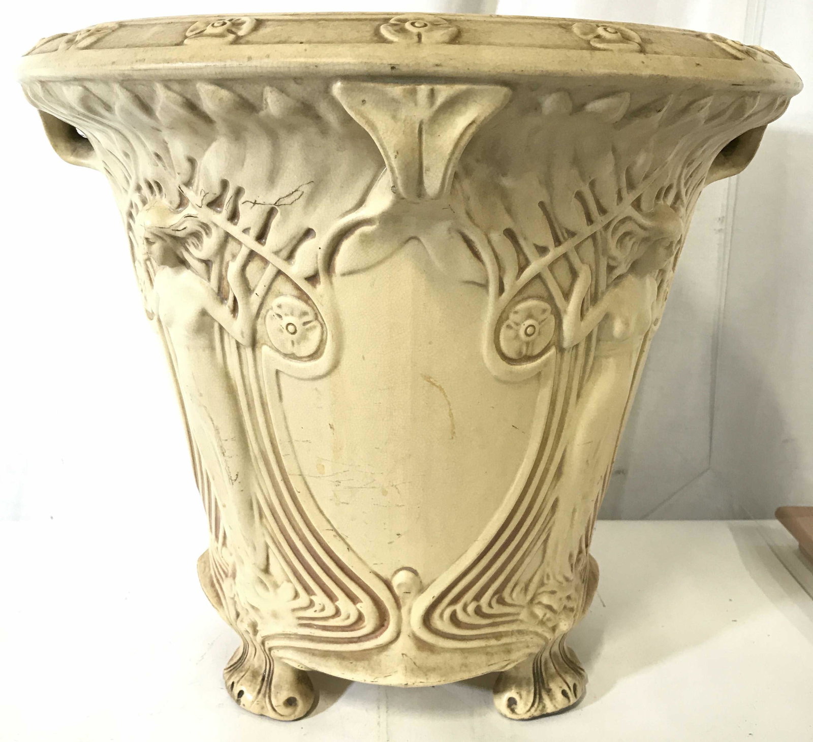 Vntge Footed Planter W Partial Female Nude Detail: Planter is vintage. Piece appears to be composite, possibly porcelain, possibly ceramic, possibly alabaster. Planter is footed. Piece has partial nude female figure detail. Piece measures approximatel