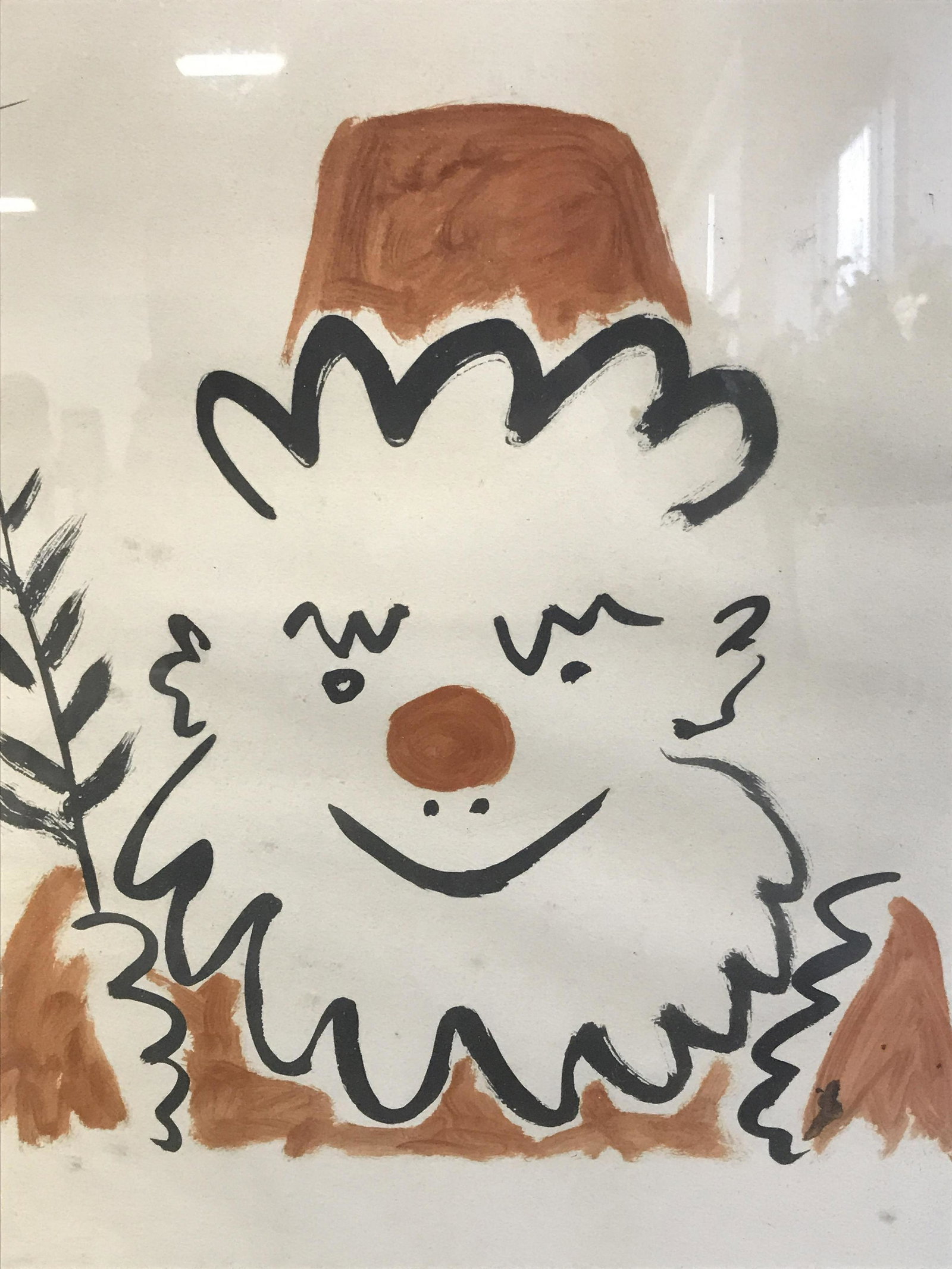 Lithographic Reproduction of a Picasso: Lithographic reproduction of a Picasso painting, signature printed in the upper left corner reads ‘Picasso’, subject a clown with beard a red nose and hat holding a leaf, no matting, black painted