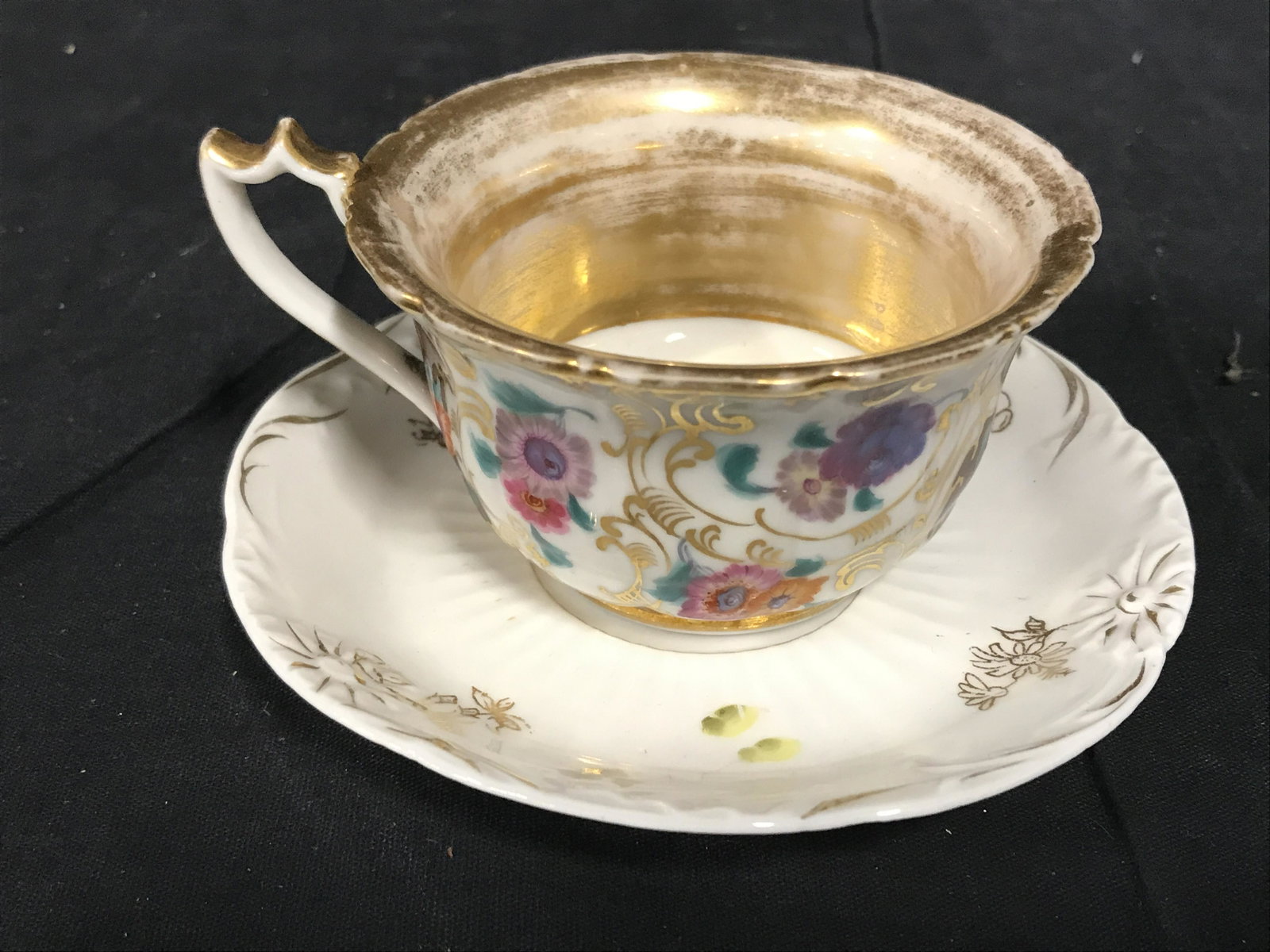 Lot 14 Assorted Porcelain Tabletop: Lot includes 6 variously sized cups & 8 variously sized saucers. Lot includes markings such as NIPPON, HAVILAND, TUSCAN, ROYAL STANDARD, AMERICAN BEAUTY, BOHEMIA & others. FlorAl detailed haviland pla