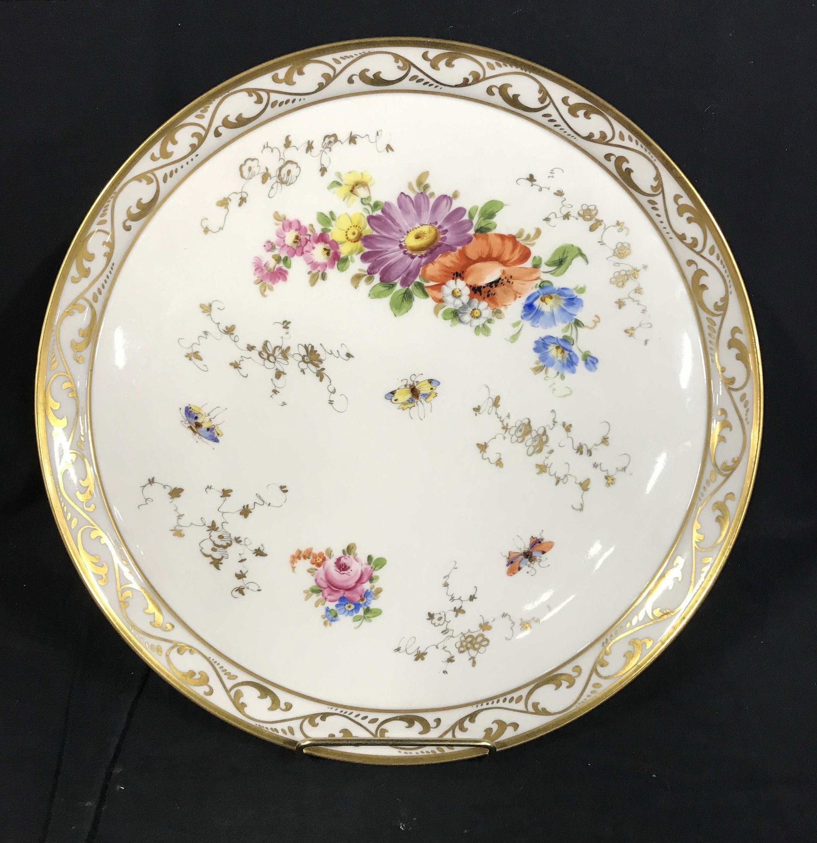 Vintage KPM Hand Painted Decorative Plate: Hand painted KPM decorative plate. Decorated with floral patterns, butterflies, and gilt paint detailing. Measures approx 12.5 inches in diameter. Wear is consistent with age. KPM, fine China, decorat