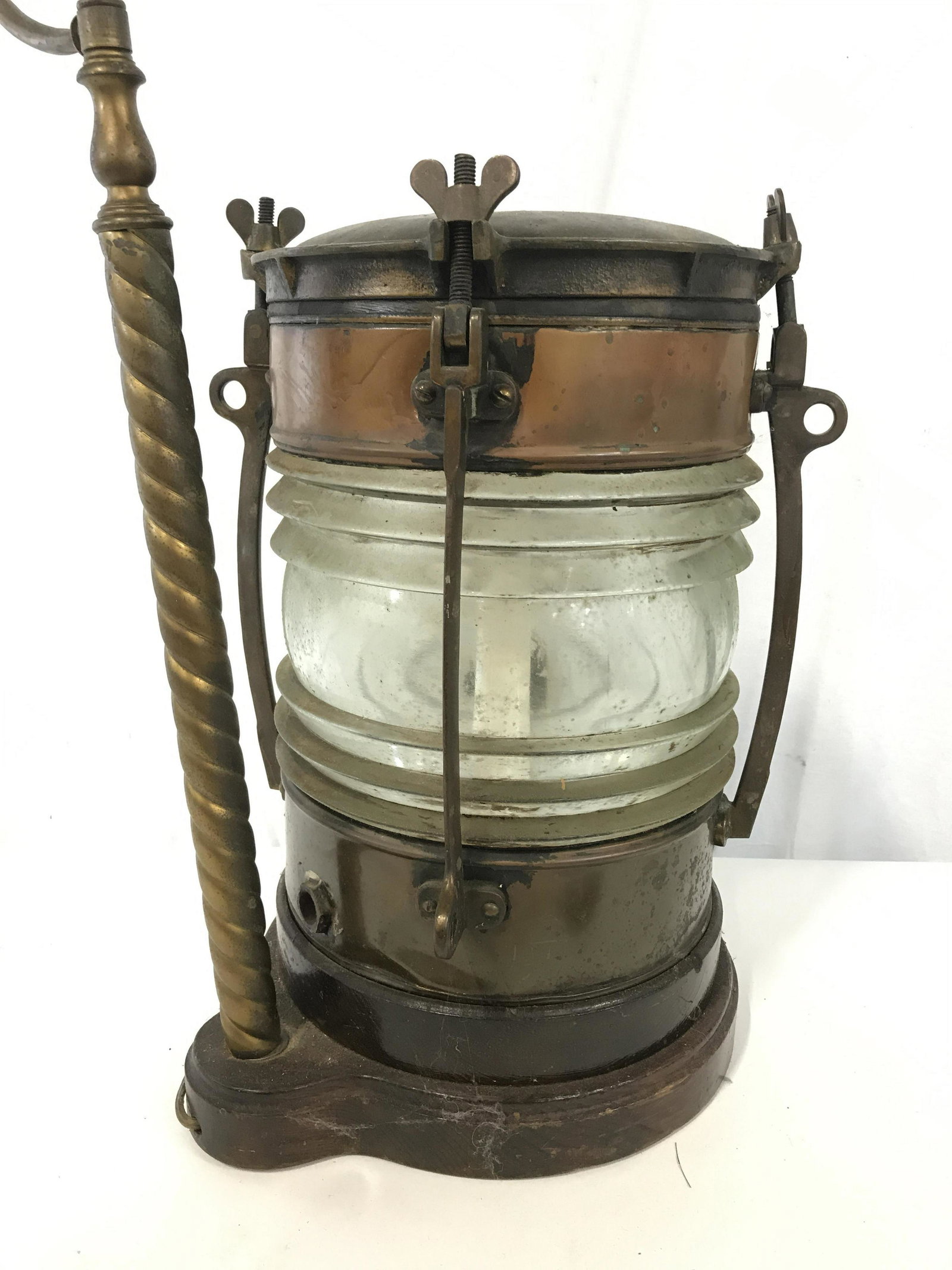 Vintage Ships Lantern Tabletop Lamp: Vintage lamp, possibly antique, converted from a TELFORD GRIER MACKAY & CO ships lantern. Eagle shaped finial. Measures approx 32.25 inches H, and 14 inches W. Wear is consistent with age and use. Lam