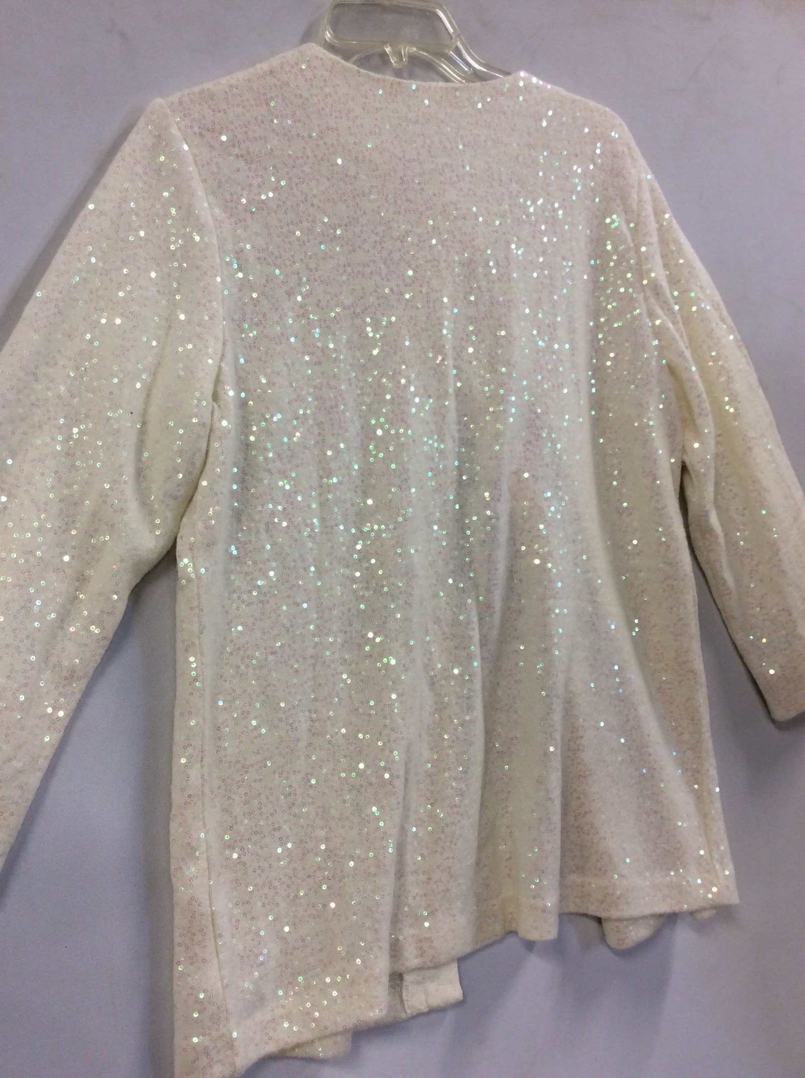 Lot 2 Ladies Sequin Apparel, Cardigan & Boots: Black sequin ladies boots, size 7.5. Rubber soles, insulated with Polartec like material, side zipper, appear never worn. Cream color button down cardigan with clear rainbow sequins. Care label, reads