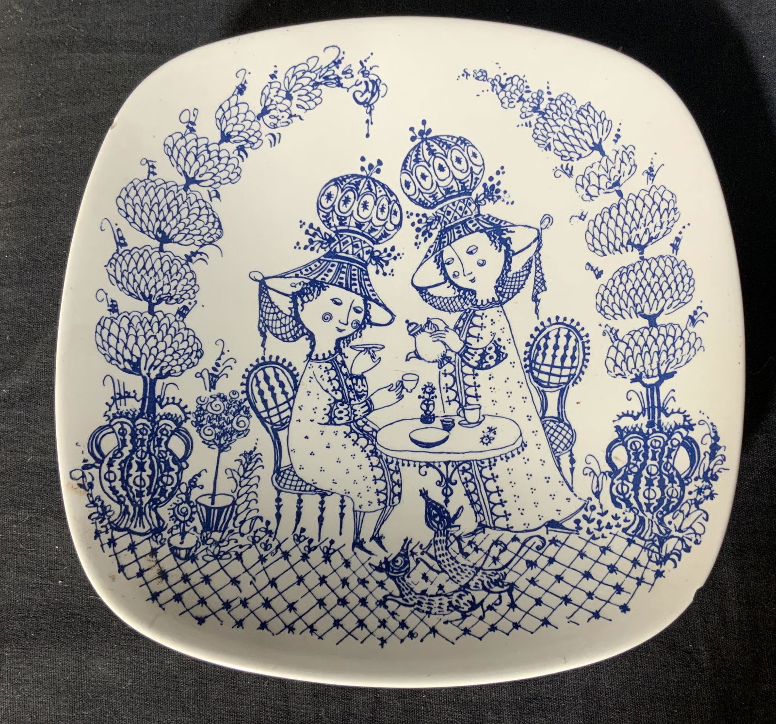 Nymolle Denmark Signed Decorative Dish: Nymolle Denmark decorative dish, stamp to base reads ‘Nymolle Denmark’, ‘Decor: Tea for Two 3101-318’, ‘Artist: Bjorn Wiinblad’, two people having tea at a table, has some chips, measures