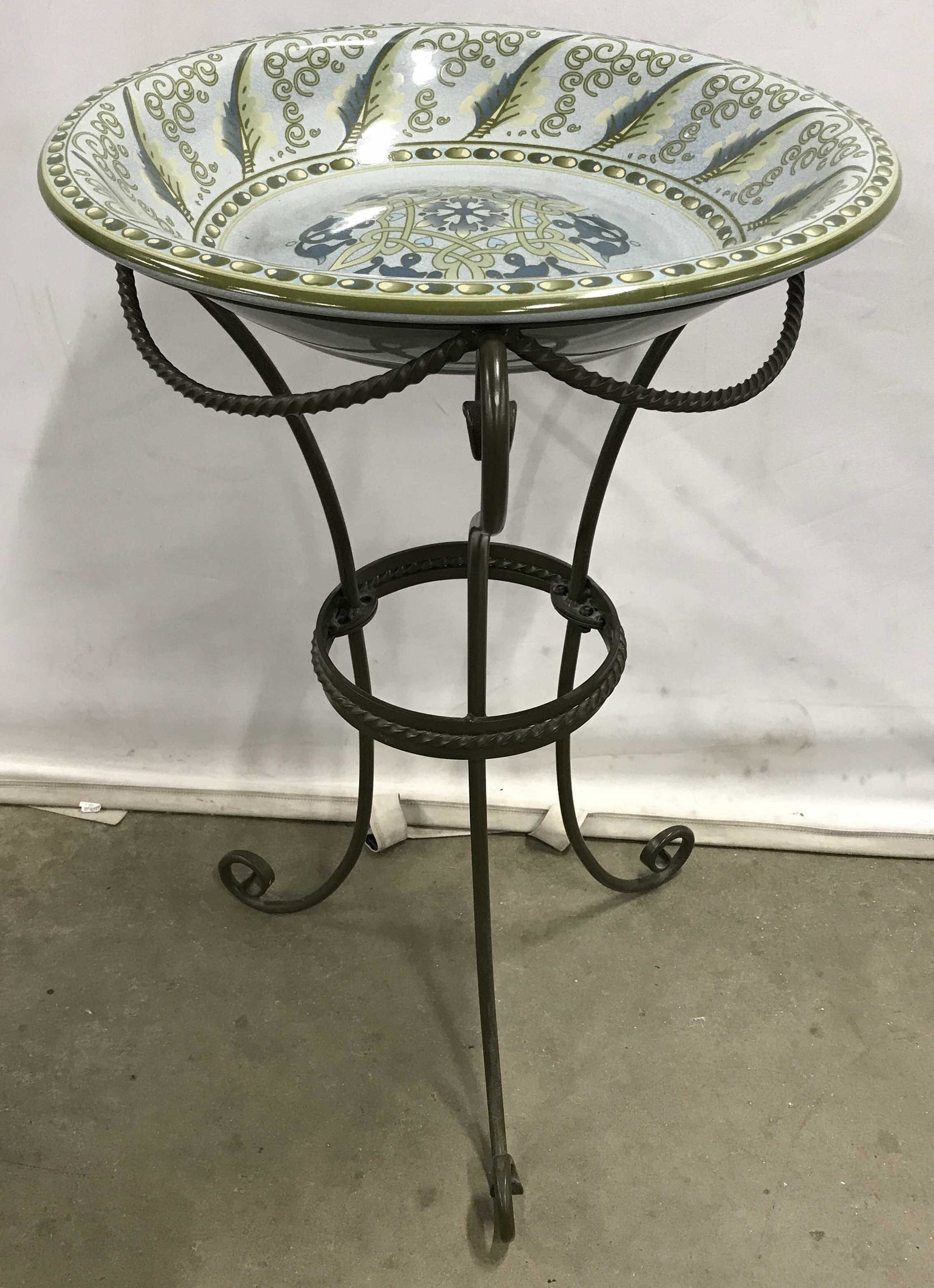 Hand Painted Bird Bath: Hand painted bird bath. Bowl is ceramic, stand is cast iron. Bowl is glazed, a medallion decorates the center of the bowl. Measures approx 30 inches H, and 18.5 inches W. Bird bath, outdoor accessorie