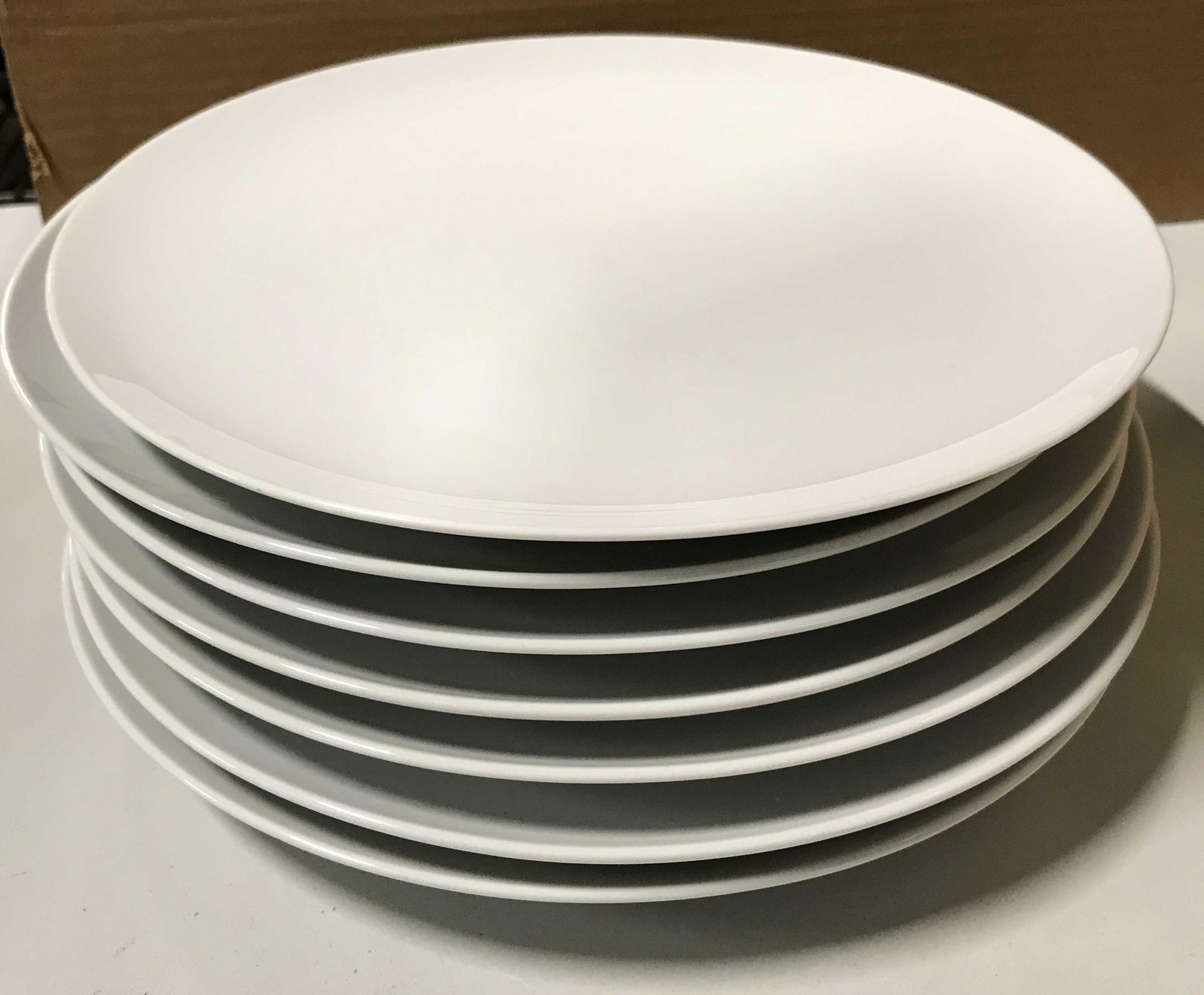 Set 7 Ceramic Dinner Plates: Off white porcelain plates, slight curvature. 10 3/8 in. Property of North salem, NY Estate Dinnerware, Dinner plates, Tabletop eating plates, Tableware, porcelain plates, ceramic plates, minimalist d