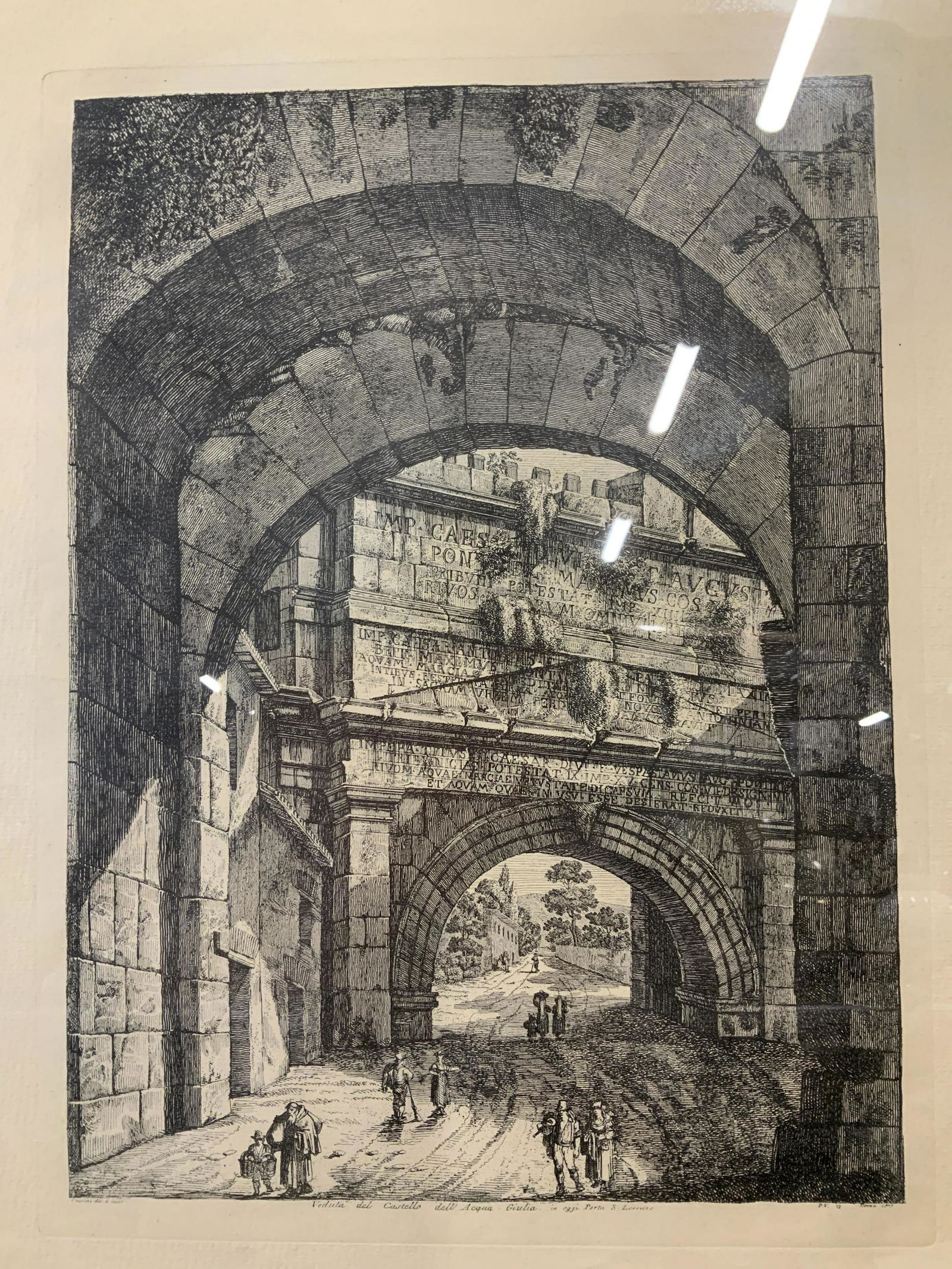 Luigi Rossini View of Castle Engraving: Luigi Rossini View of Castle Engraving, after the artist’s original work, inscription to lower portion of piece in Italian, a view of people walking under arches, measures 31 7/8 x 23 7/8 inches, si