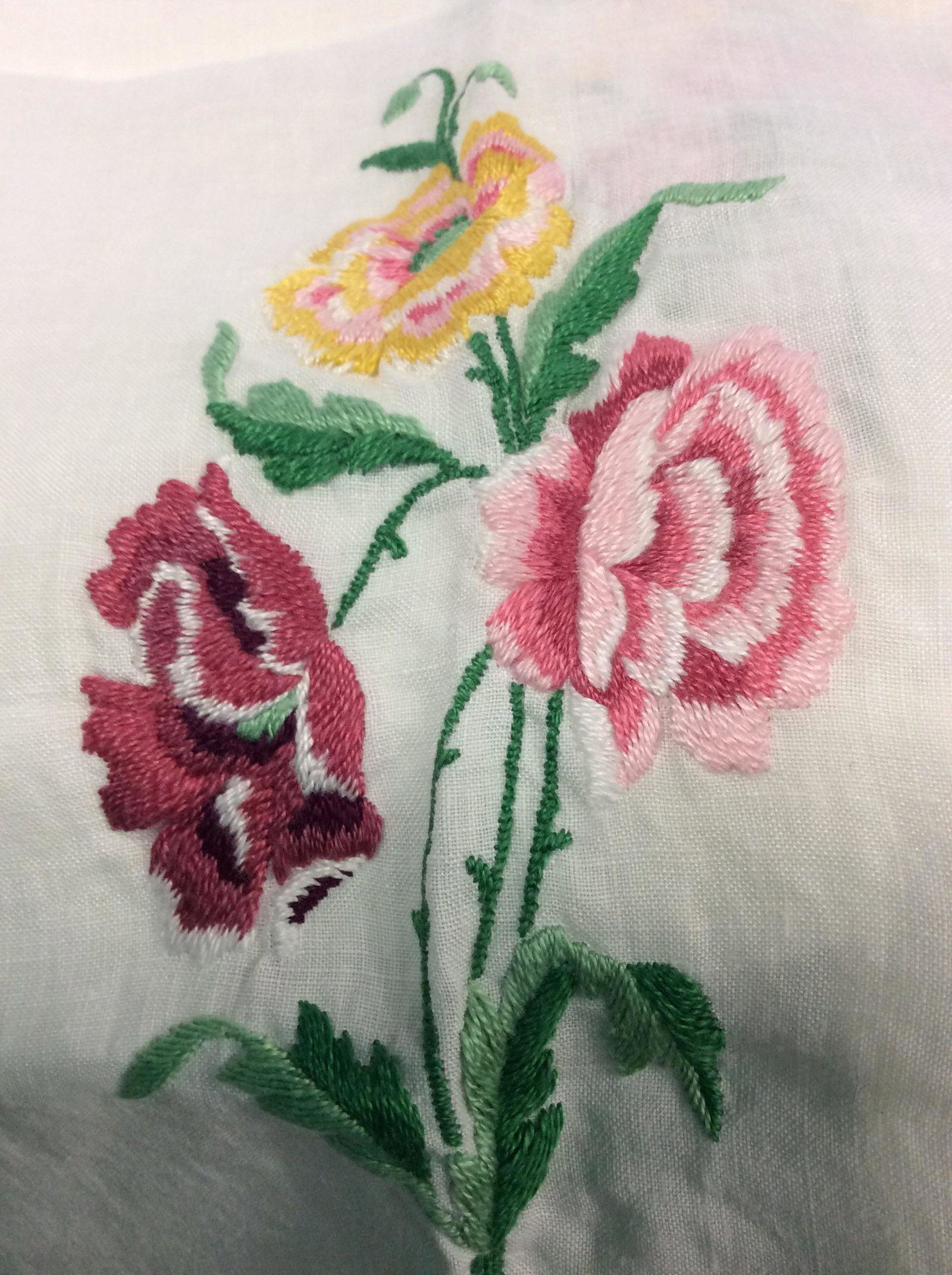 Lot of Vintage Table Linens: Round Linen Tablecloth, White with yellow fruit design.app 68 in. Diameter. Round rust color tablecloth, pierced design, polyester. App 72 in. Diameter. Round multi pattern tablecloth, cotton. App 72