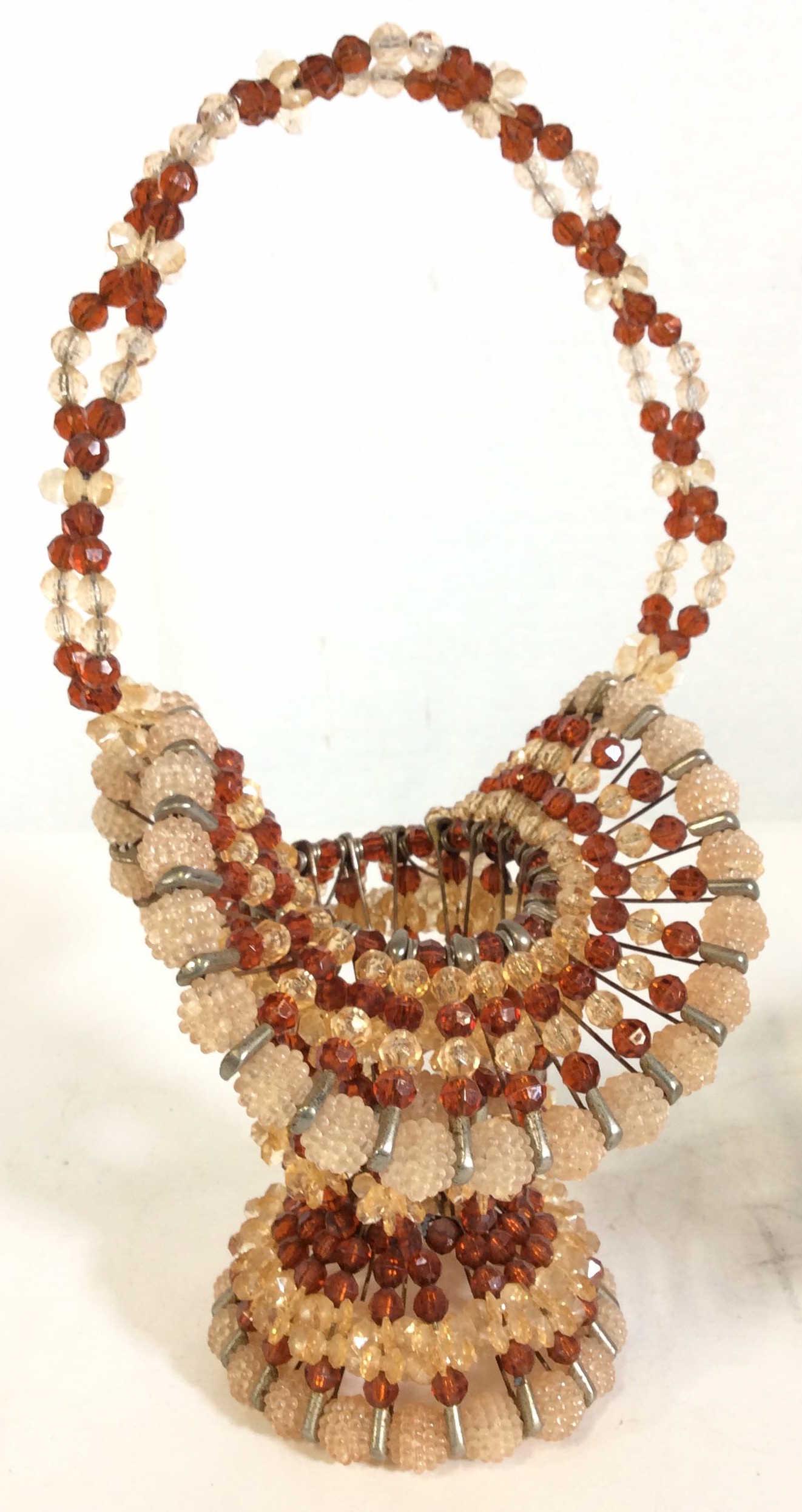 Mid Century Safety Pin Beaded Basket, Tramp Art: This Safety Pin Basket is Decorated with light pink and amber toned Faceted beads, many shapes and oddities. Ht 13 in. Width 7 in. Mid Century Safety Pin Basket, Beaded Safety Pin Basket, Mid Century