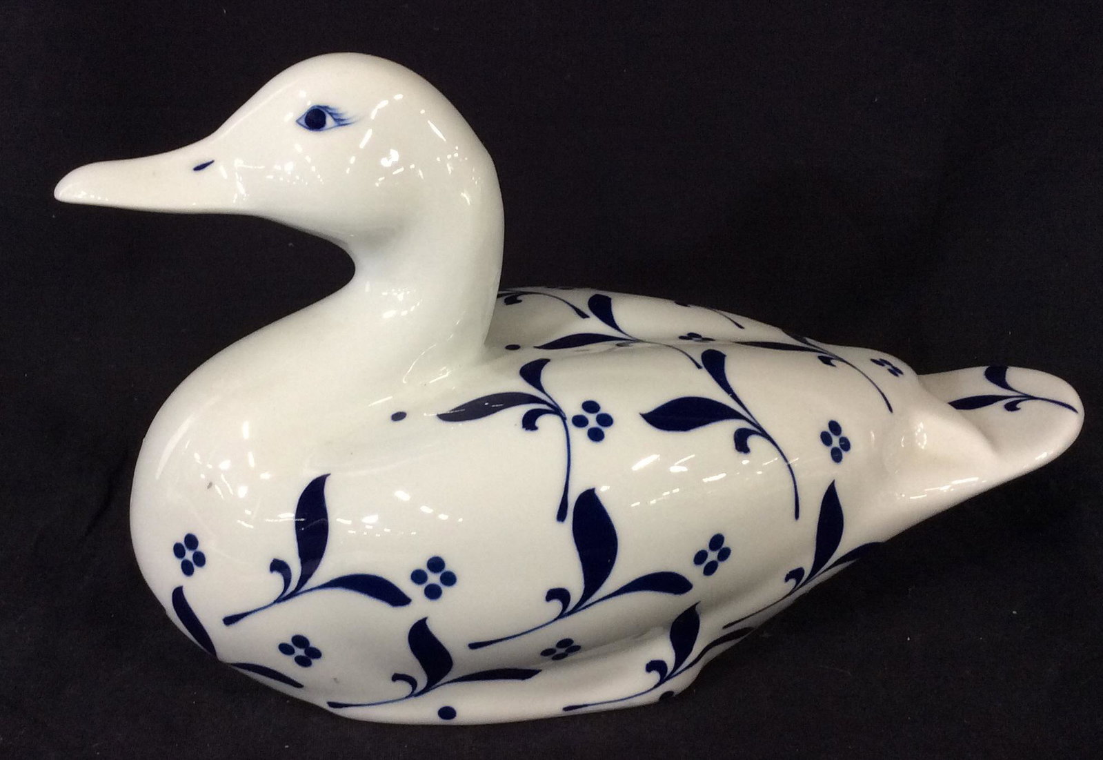 Collectible Doucai Porcelain Duck Figural: Large Hand painted Duck Figural, Blue & White Paint under glaze after Ming Dynasty, which modified blue colors & re-fired Porcelainware With glaze over paint enriching color. 13 x 5.75 in. Ht 6.5 in. 