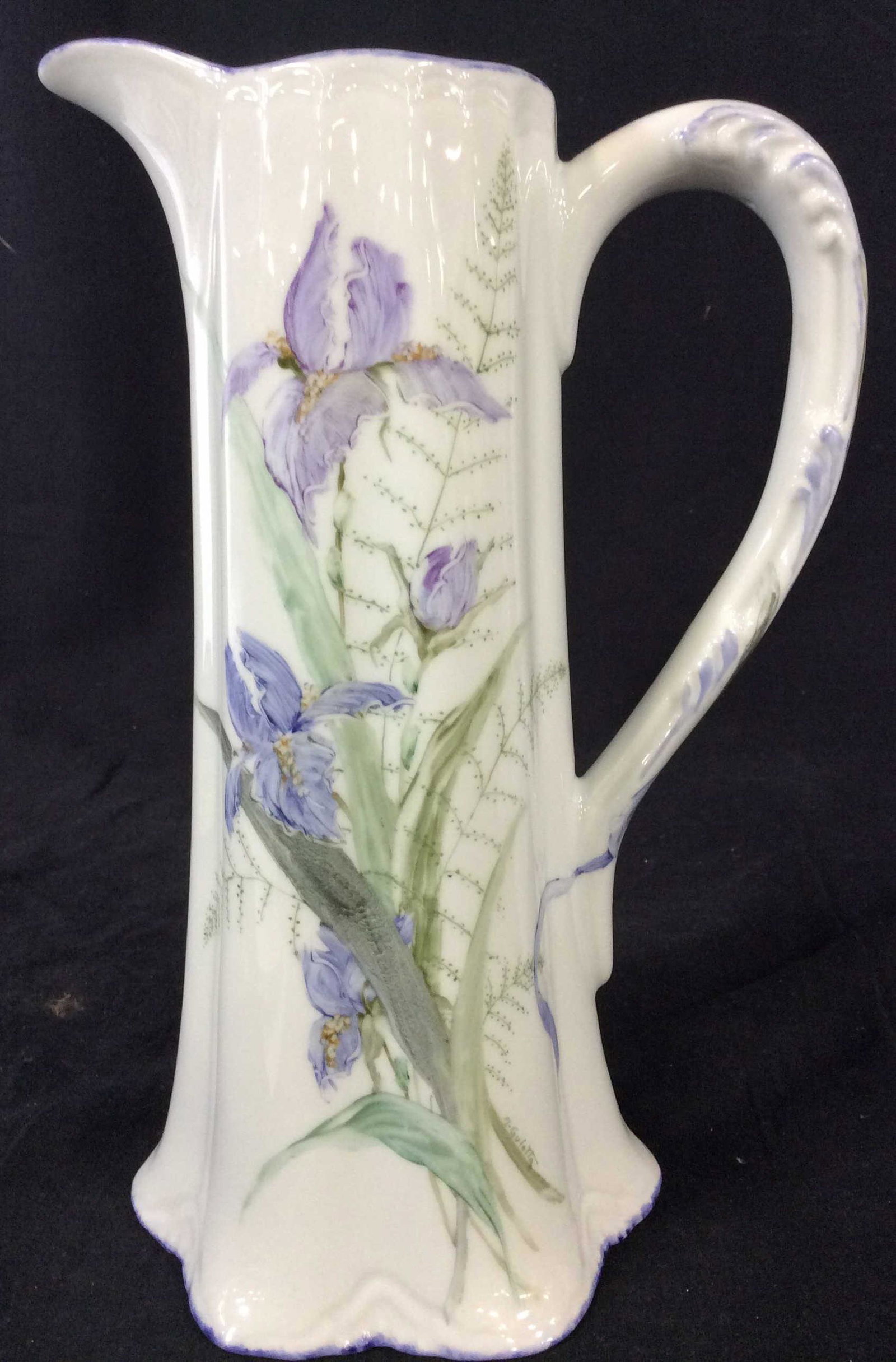 Original GULOTTA Signed Iris Ceramic Pitcher: Famed American Artist Signed. Stark white glazed porcelain Water Pitcher/ vase/ Vessel Hand Painted with Iris over glaze. Verso Hand Signed M. Gulotta Original. Touches of violet with light green laur